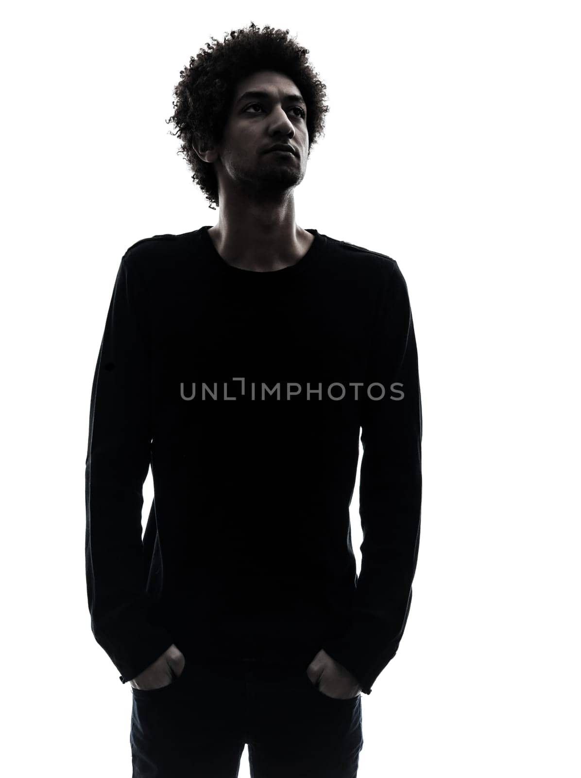 one african handsome young man looking away in silhouette studio isolated on white background