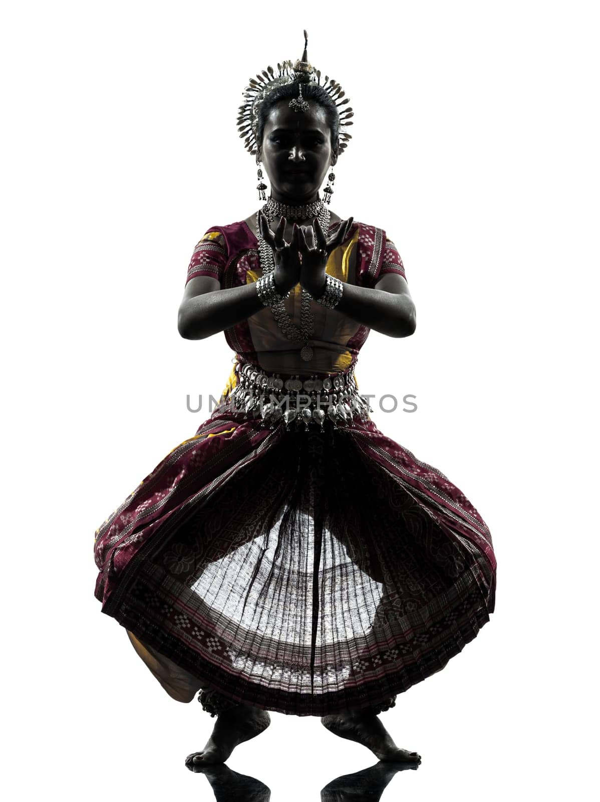 one indian woman dancer dancing in silhouette studio isolated on white background
