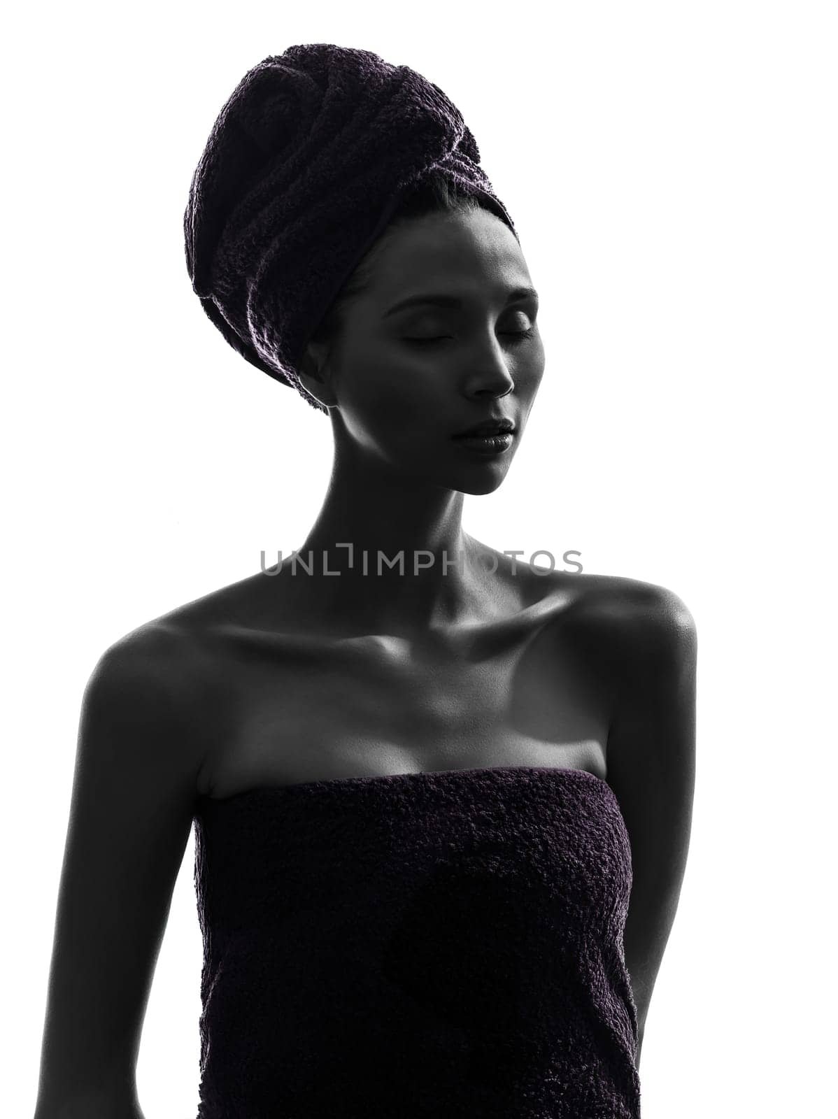 one beautiful asian young woman eyes closed portrait wrapped towel in silhouette studio isolated on white background