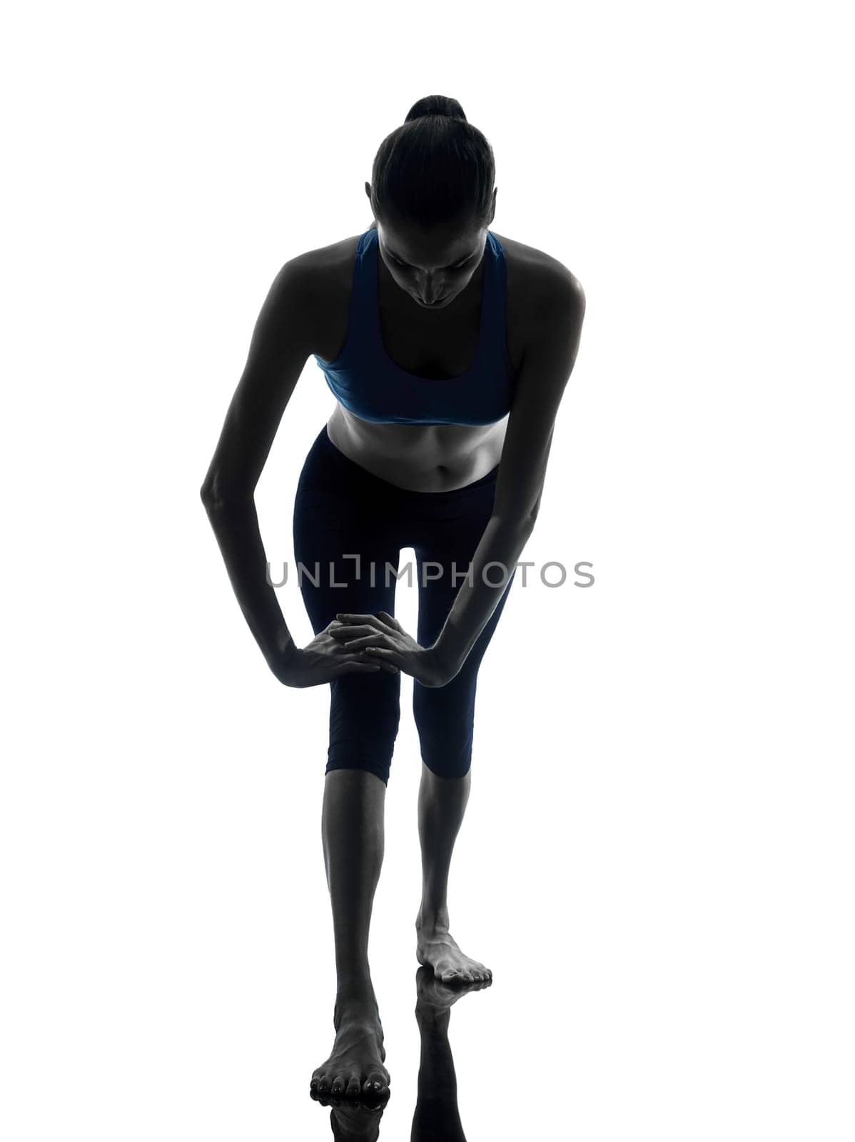 one caucasian woman exercising yoga warrior position in silhouette studio isolated on white background
