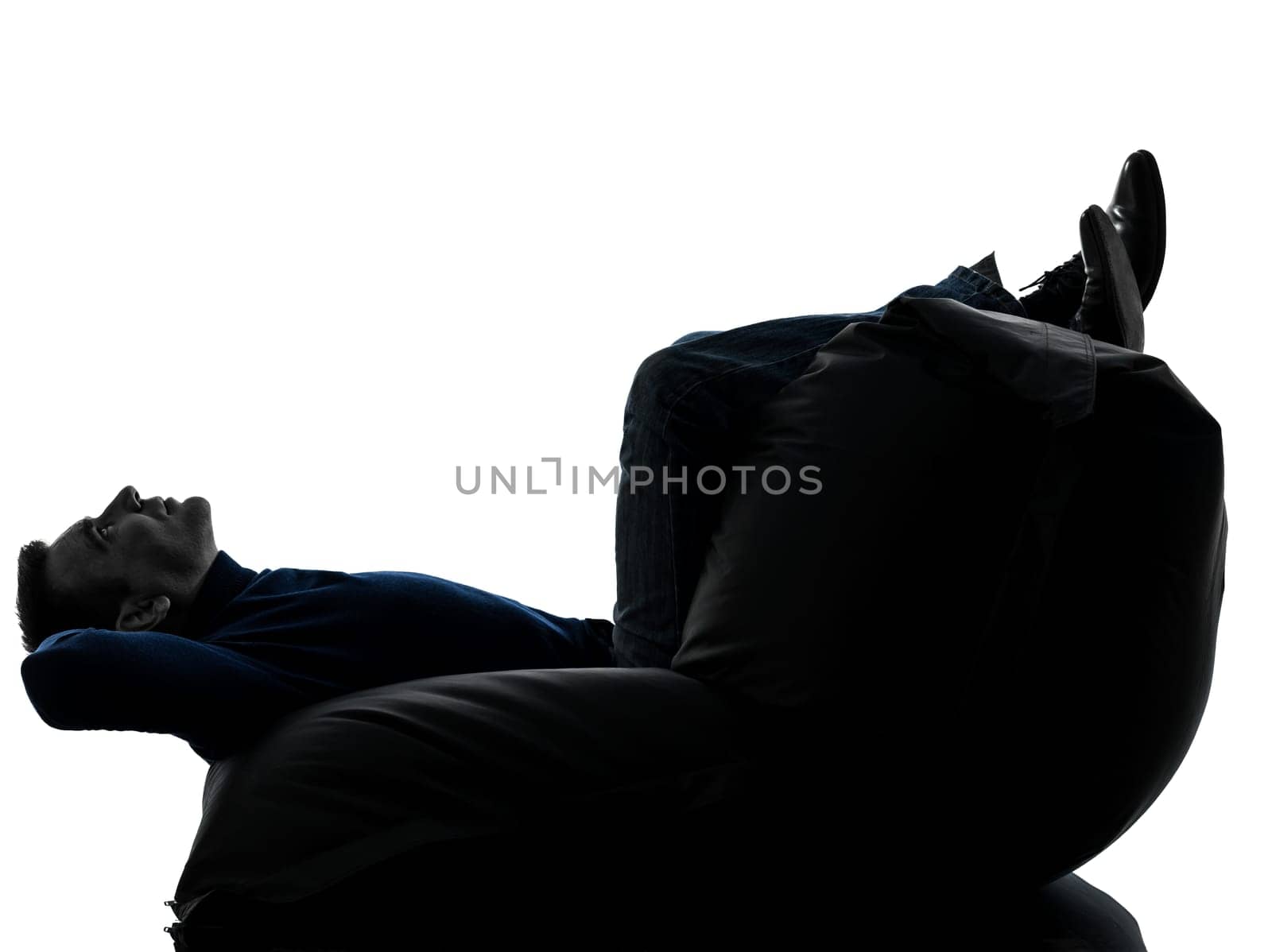 one caucasian man full length in silhouette studio isolated on white background