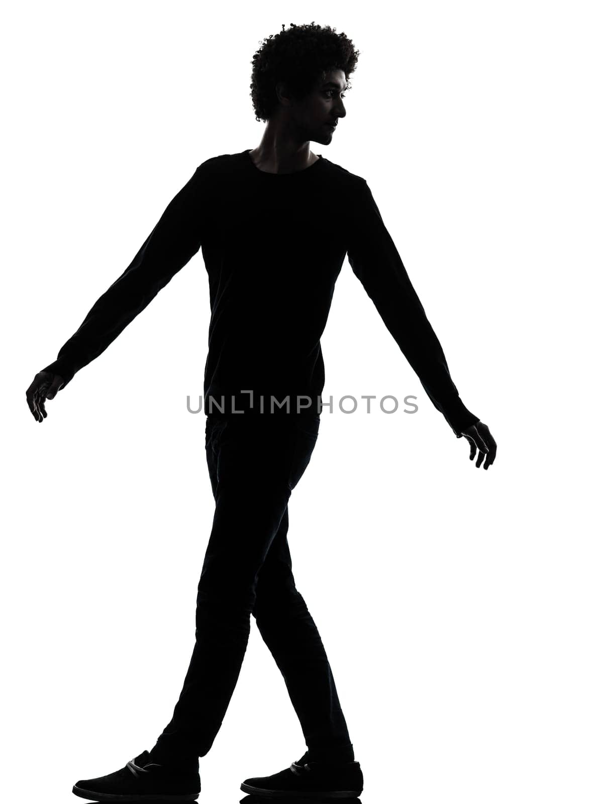 one african handsome young man looking back in silhouette studio isolated on white background