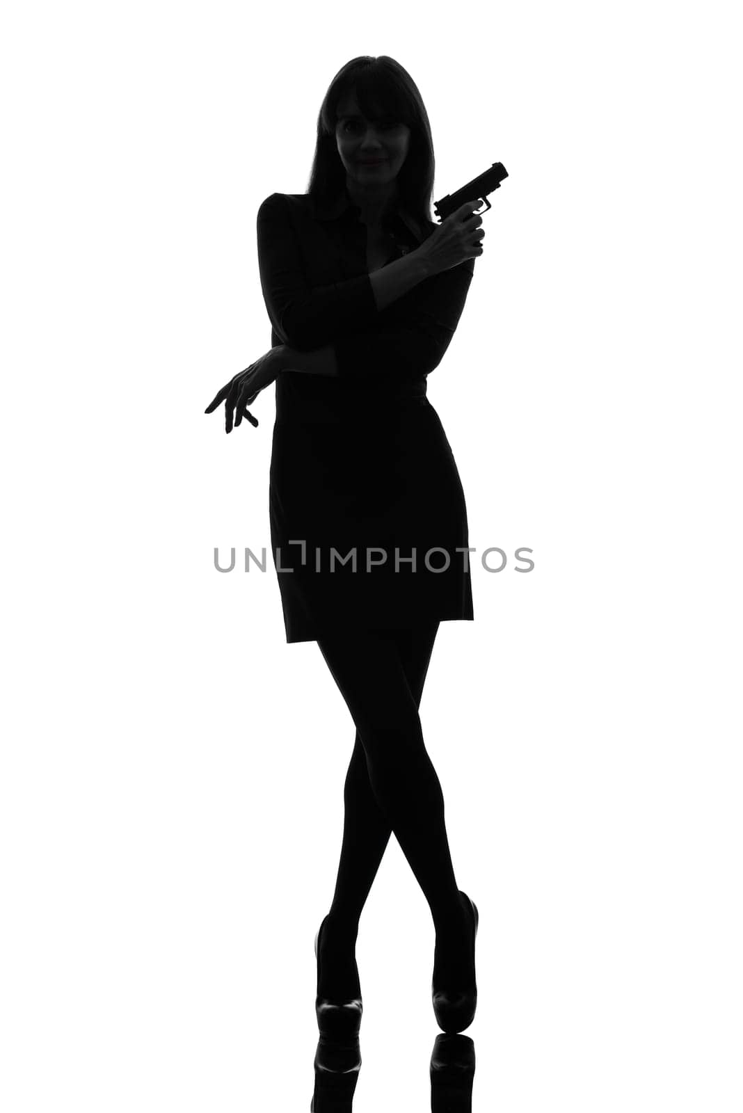 one caucasian sexy detective  woman holding aiming  gun in silhouette studio isolated on white background