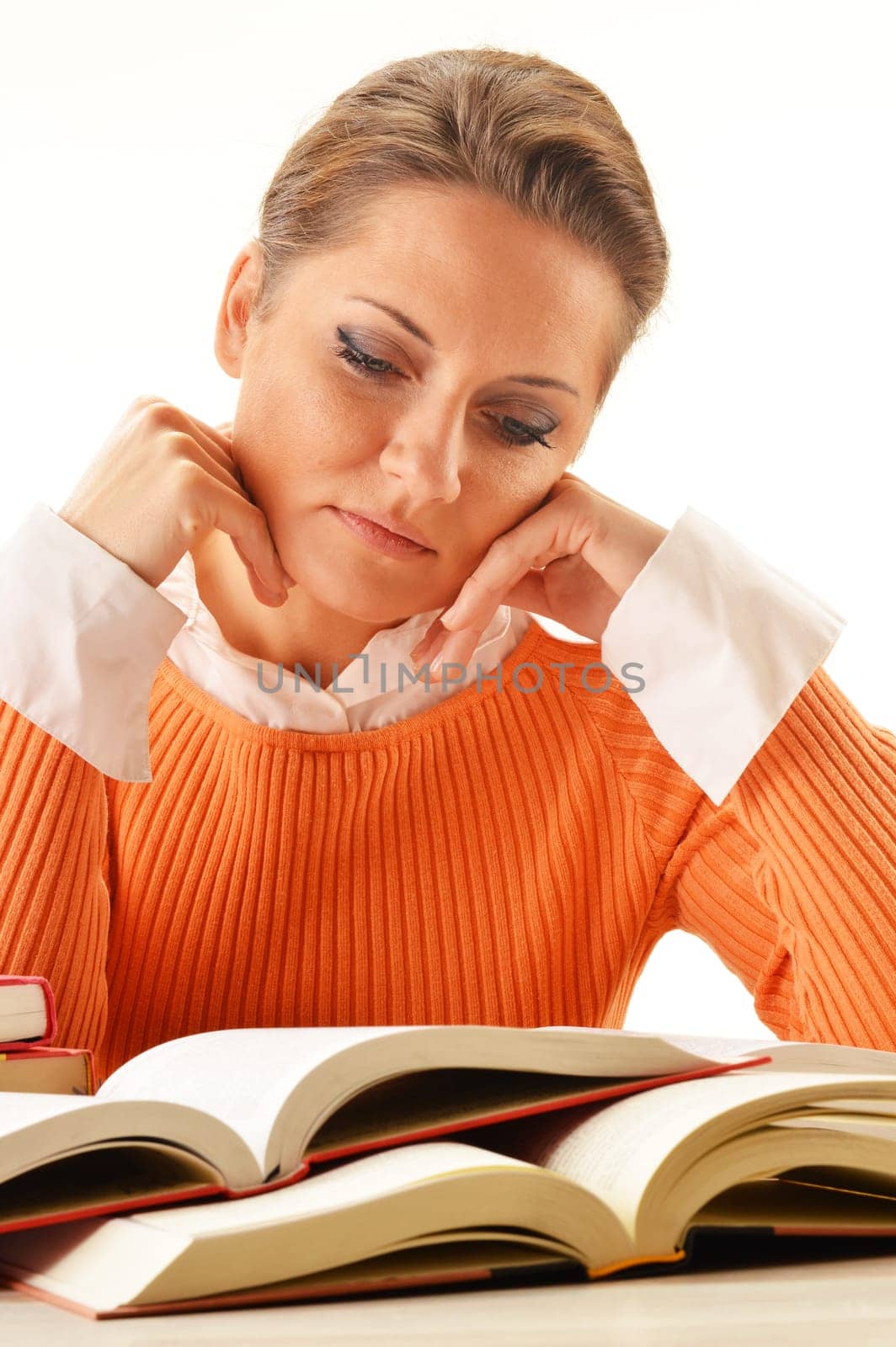 Young woman reading a book. Female student learning