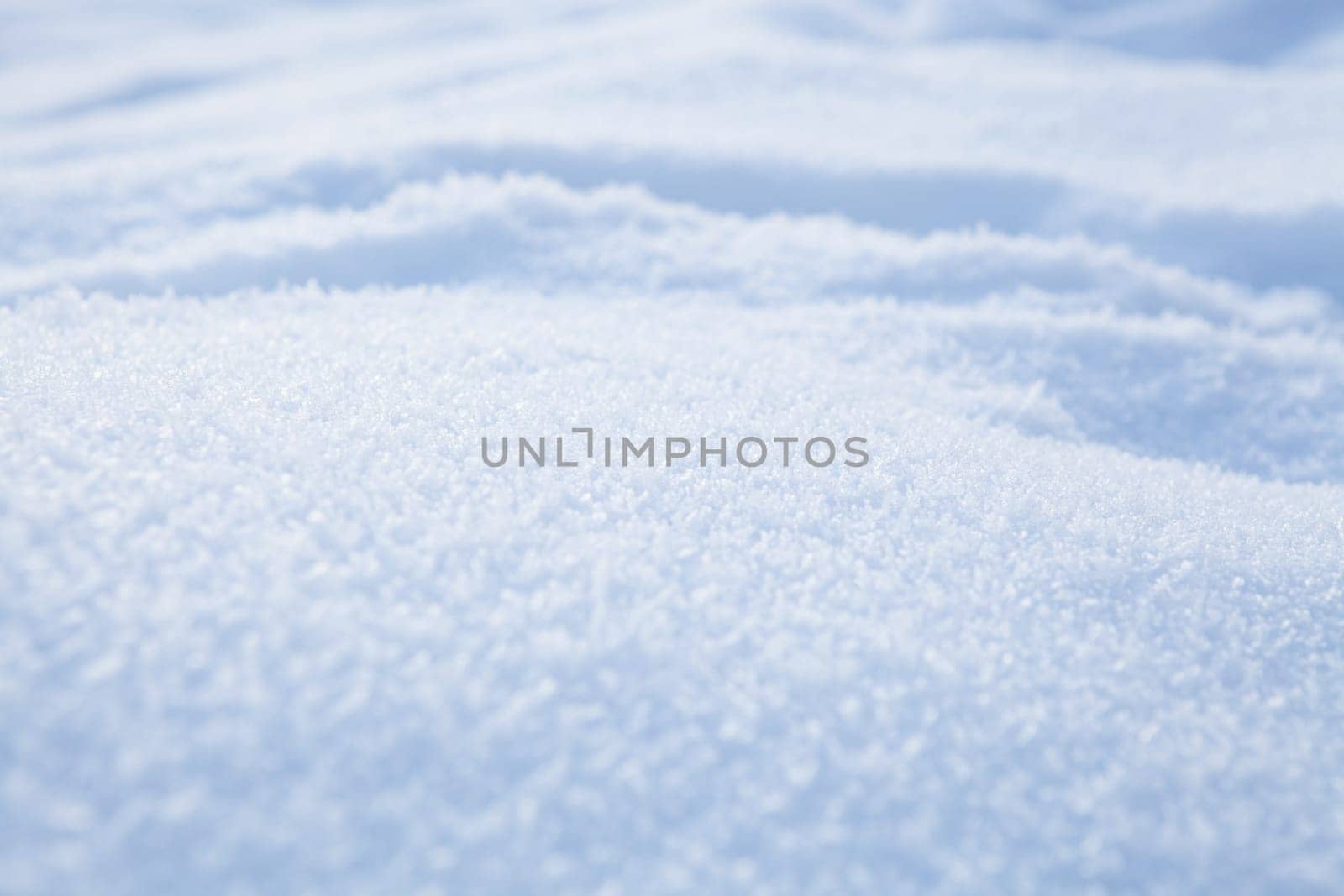 Fresh white powder snow background from outdoors on winter day