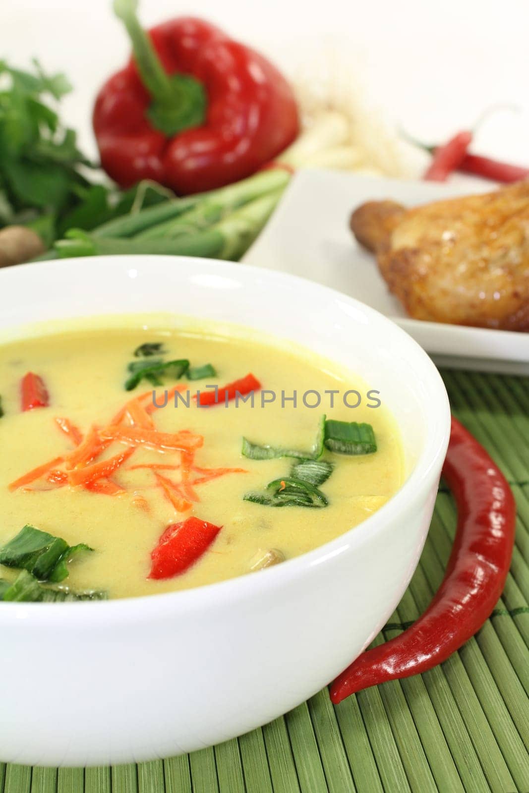 Curry soup with colorful vegetables and chicken