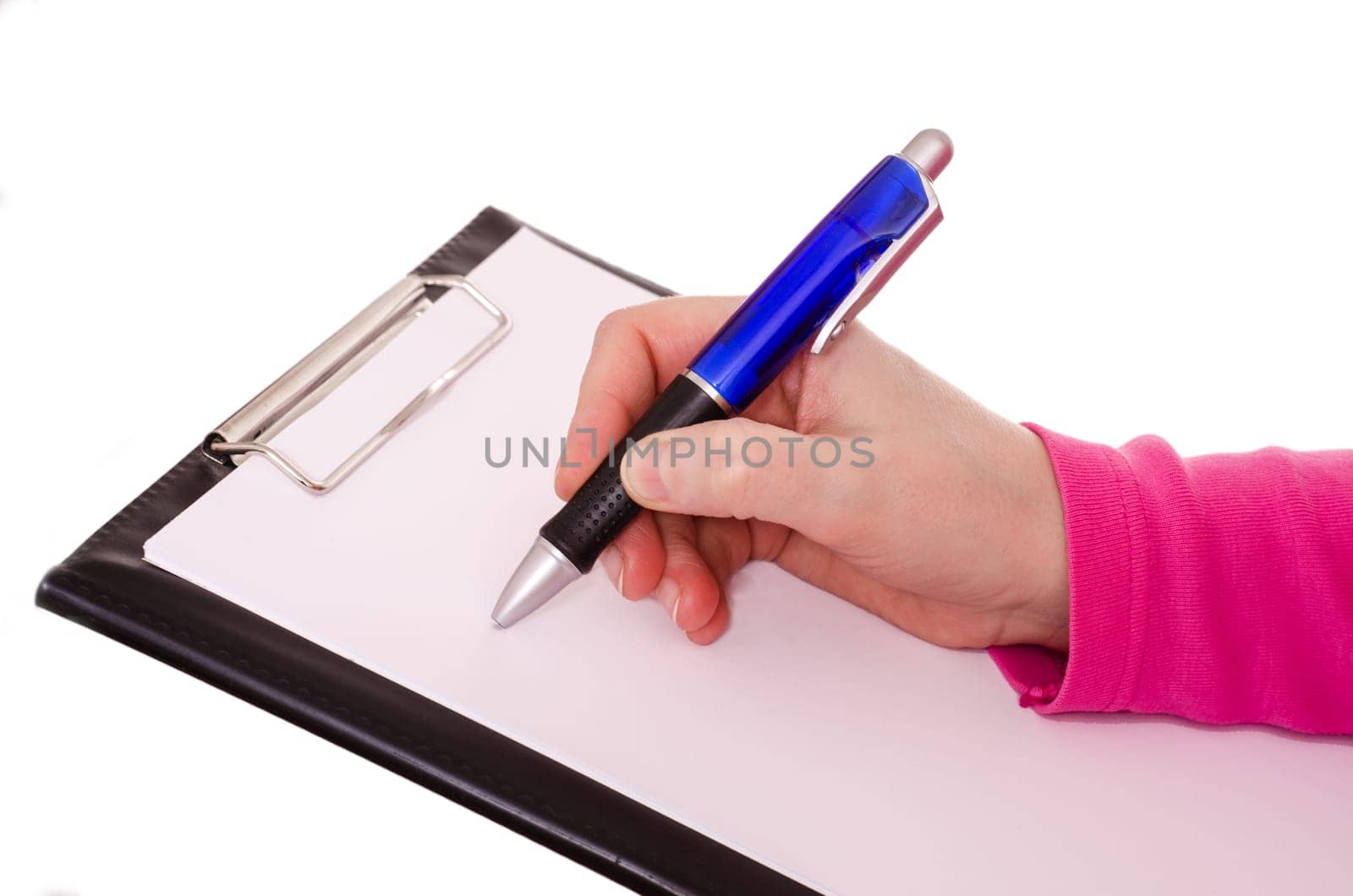 Female hand writing with an envelope pen on a sheet of paper