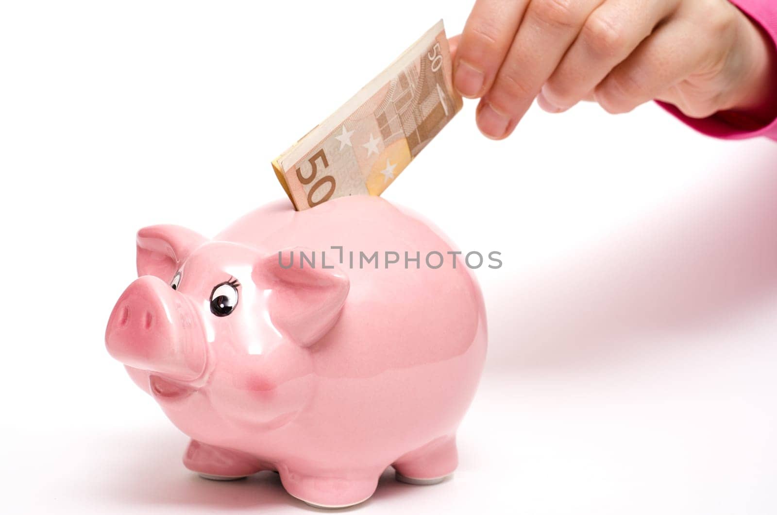 Pink piggy bank with 50 euro bill