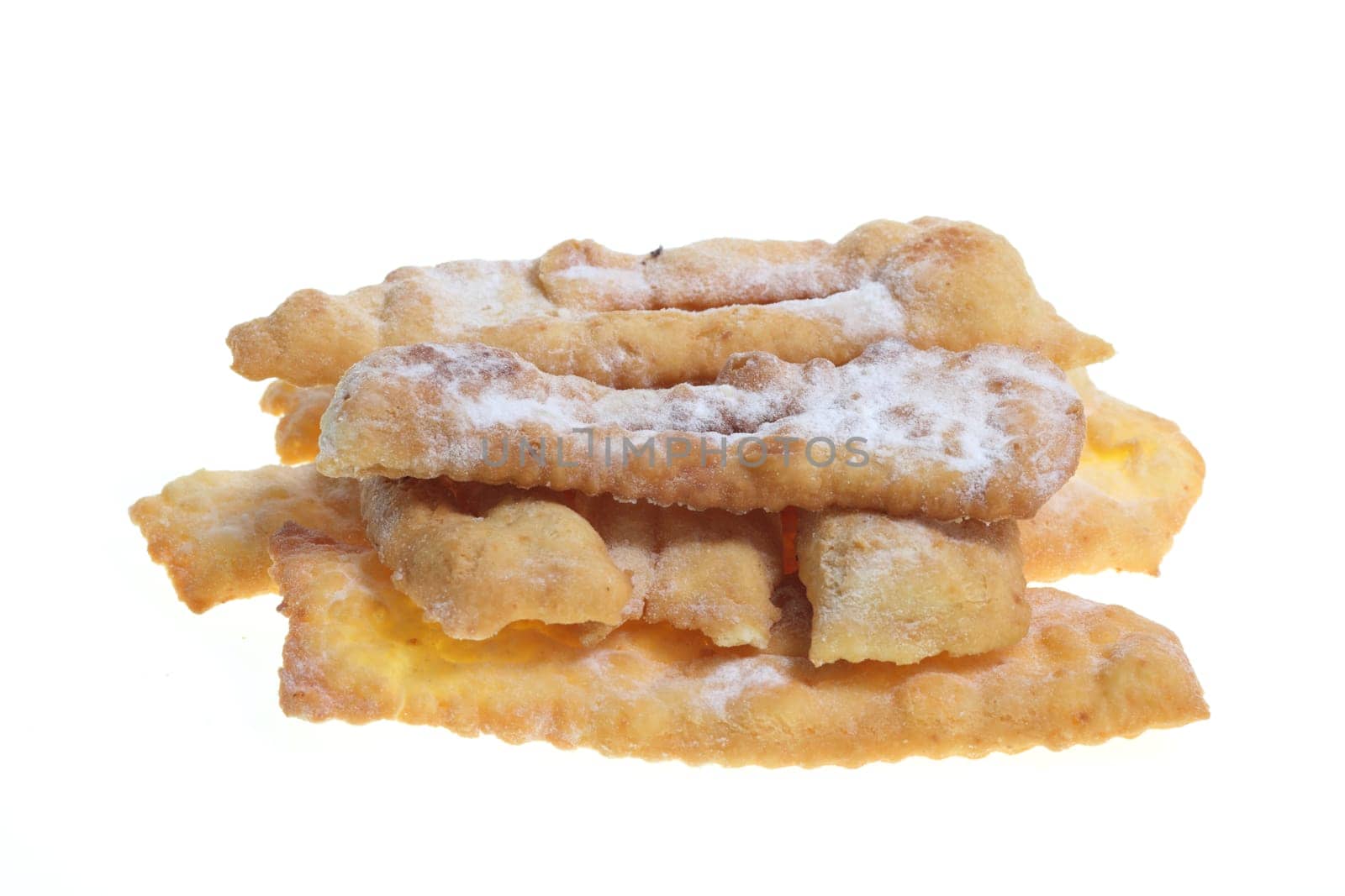 Details of "Angel wings"" or ""bugnes"" are a french traditional sweet crispy pastry made out of dough that has been deep-fried and sprinkled with powdered sugar."