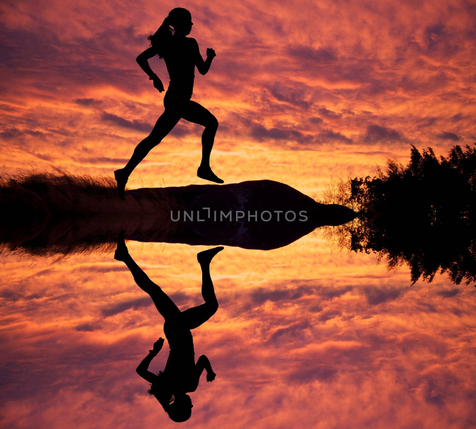 Female runner silhouette against the sunset