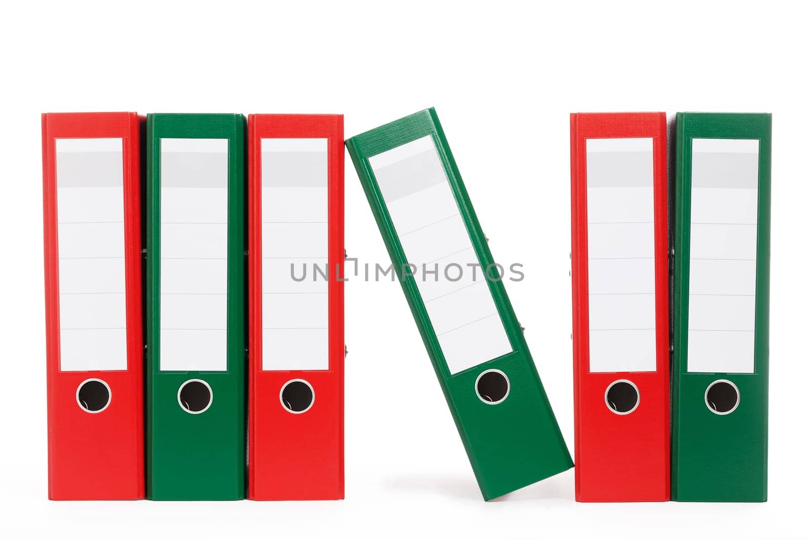Ring binder,one leaning,in a row on white background