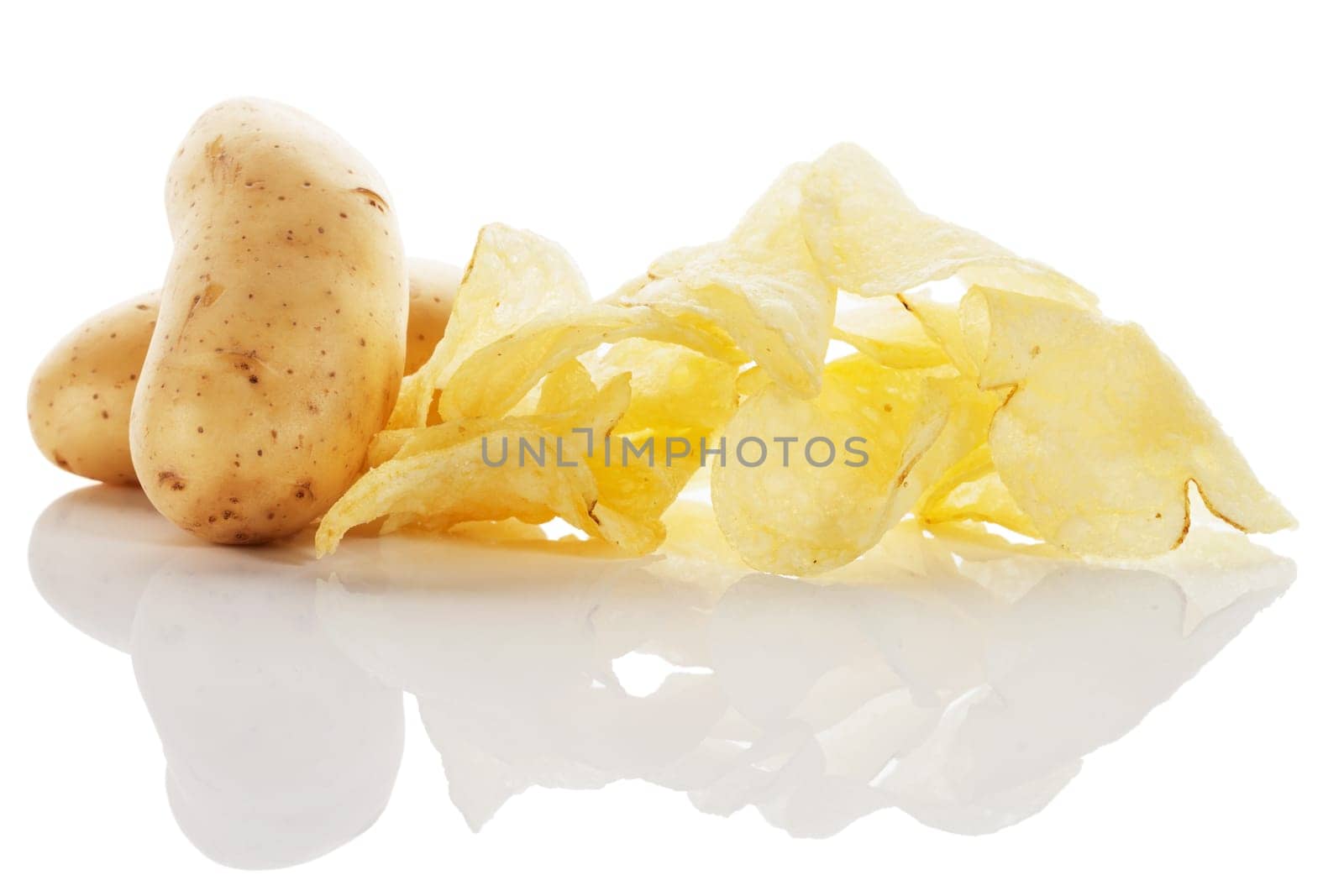 Potato chips with potatoes on white background