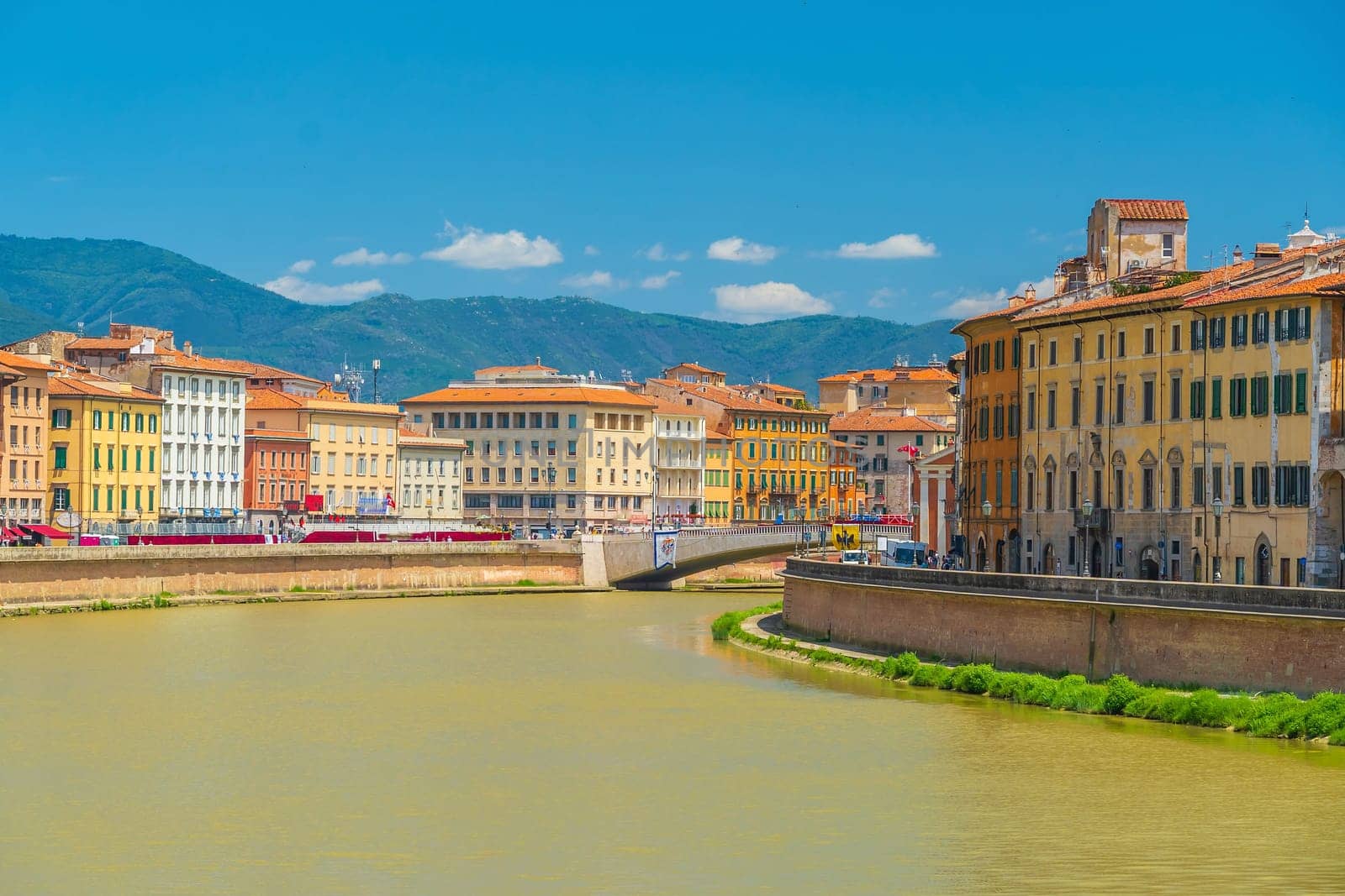 View of the medieval town of Pisa and river Arno in Italy