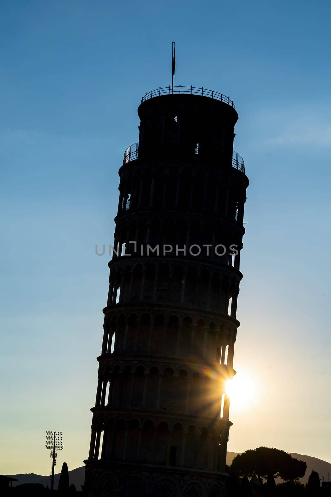 Silhouette shot of The famous Leaning Tower in Pisa, Italy with beautiful sunrise