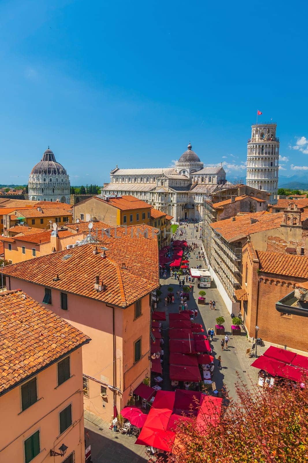 The famous Leaning Tower in Pisa, Italy with beautiful blue sky