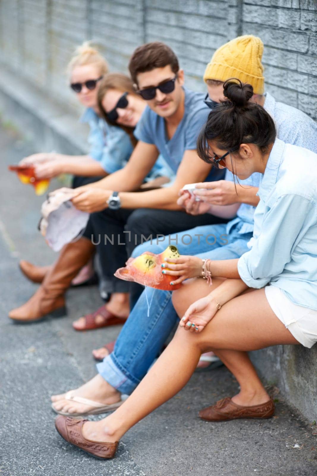 Street, friends and people with animal mask for fashion party, bonding and talking. Group, sunglasses and dress up in city, stylish men and women or hipsters sitting outdoor together for Halloween.