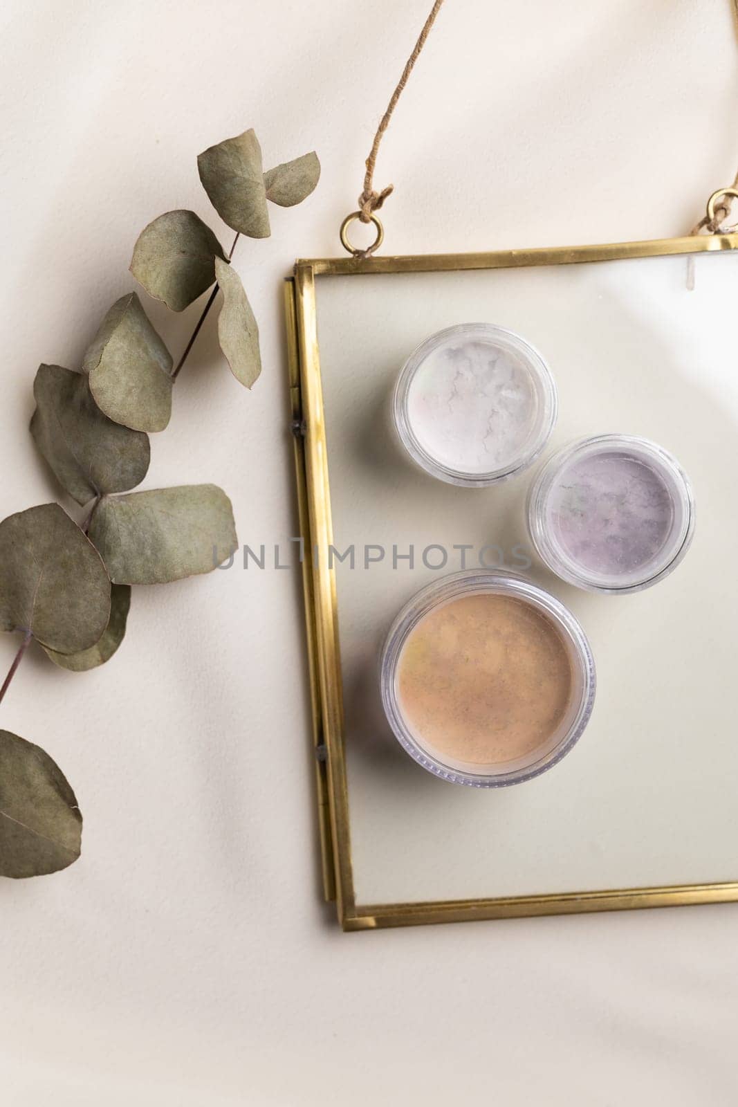 Top view eye shadow and facial powder on natural background with dried flowers. Aesthetics of makeup artist, make-up for yourself and beauty salon by Satura86