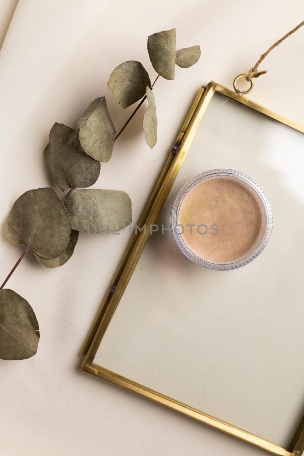Top view facial powder on natural background with dried flowers. Aesthetics of makeup artist, make-up for yourself and beauty salon by Satura86