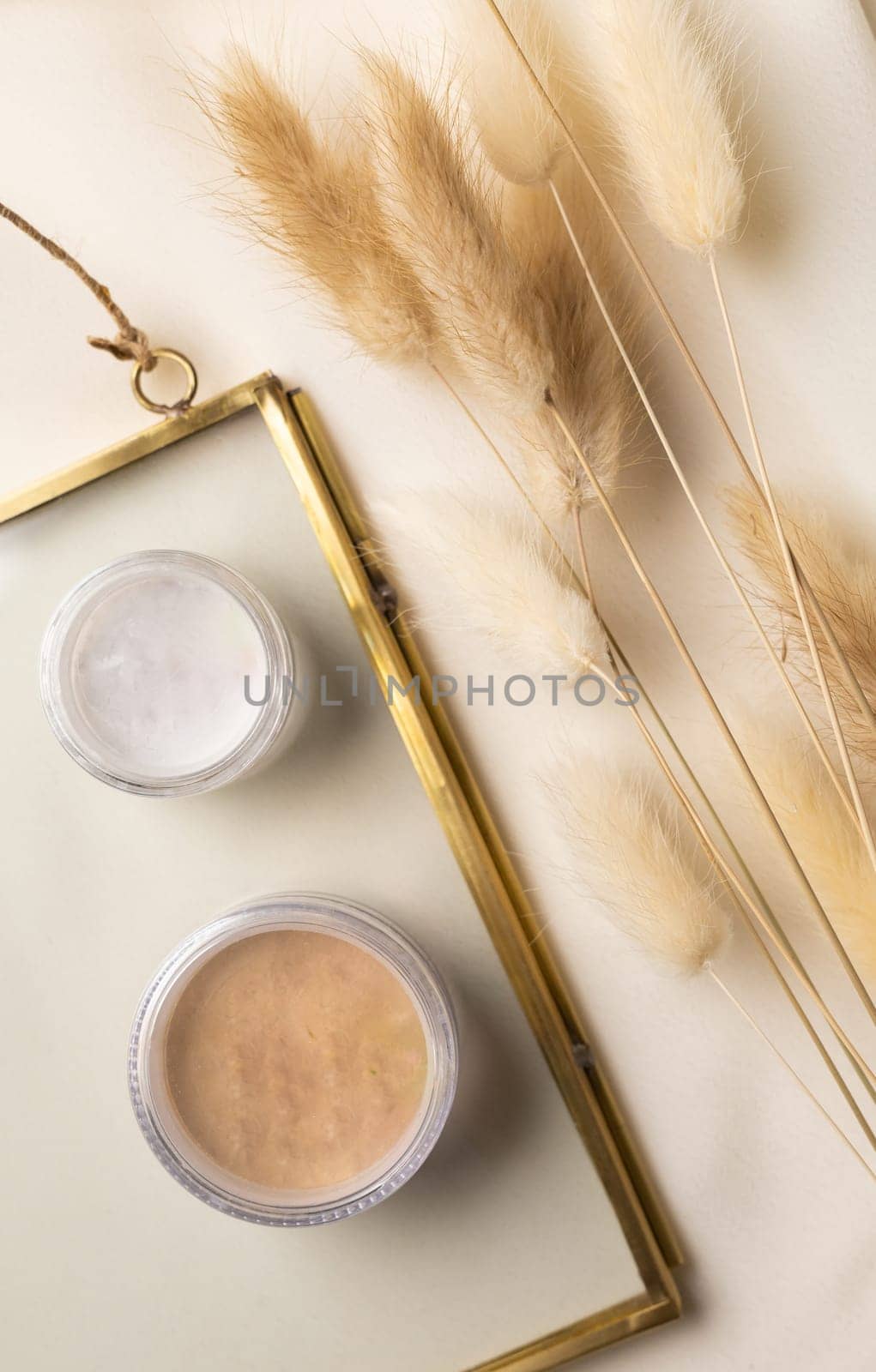 Face powder for make up in boxes on natural background with dried flowers. Aesthetics of makeup artist cosmetic beauty top view by Satura86