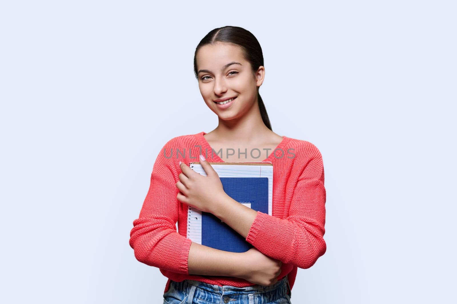 Portrait of teenage high school student on white studio background by VH-studio