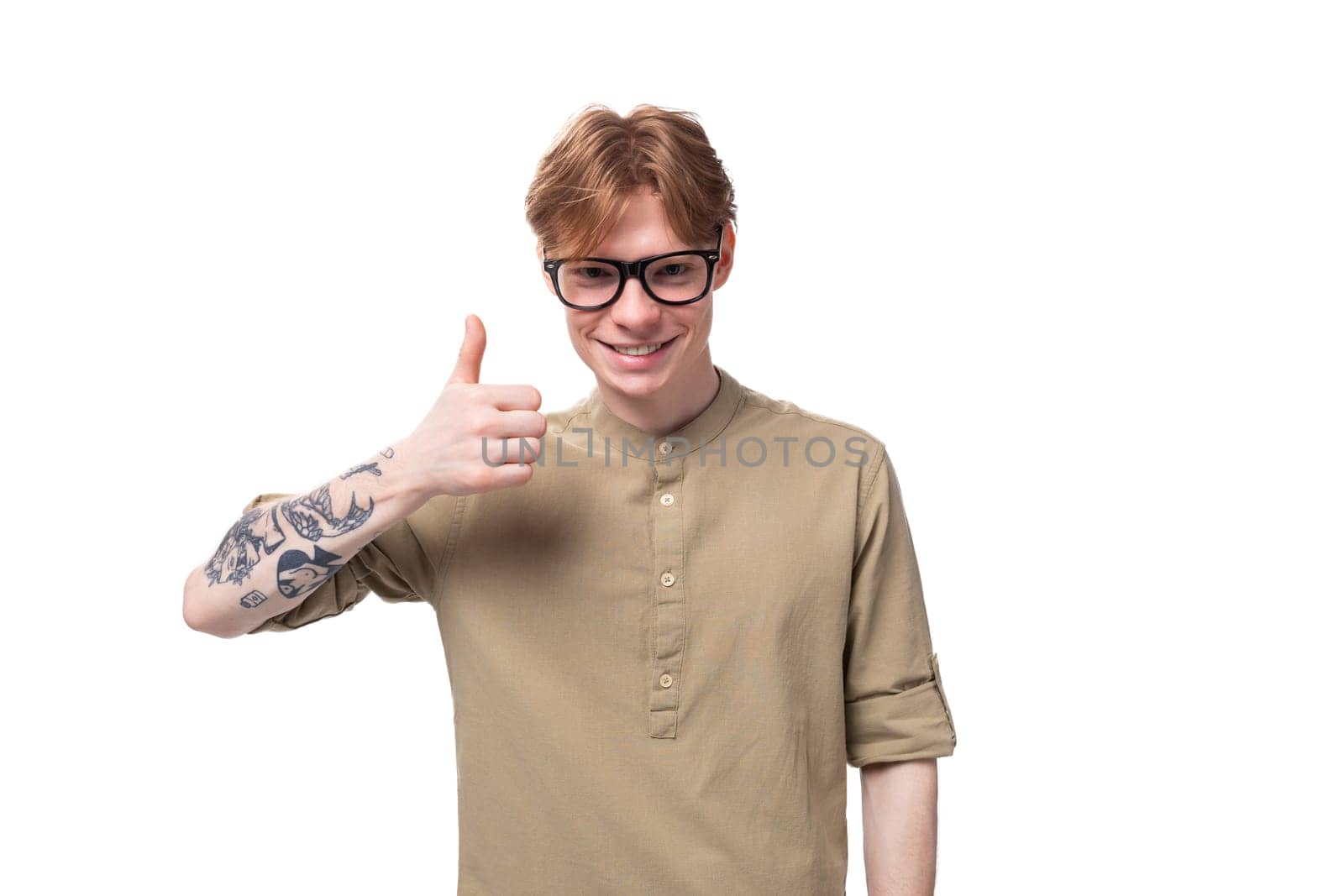 young smart man with red short hair in a brown shirt by TRMK