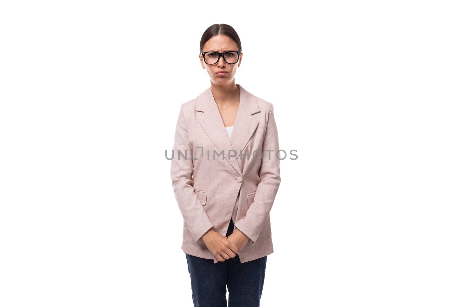 the leader is a pretty 30 year old business woman with black hair wearing a beige jacket wears eyeglasses by TRMK