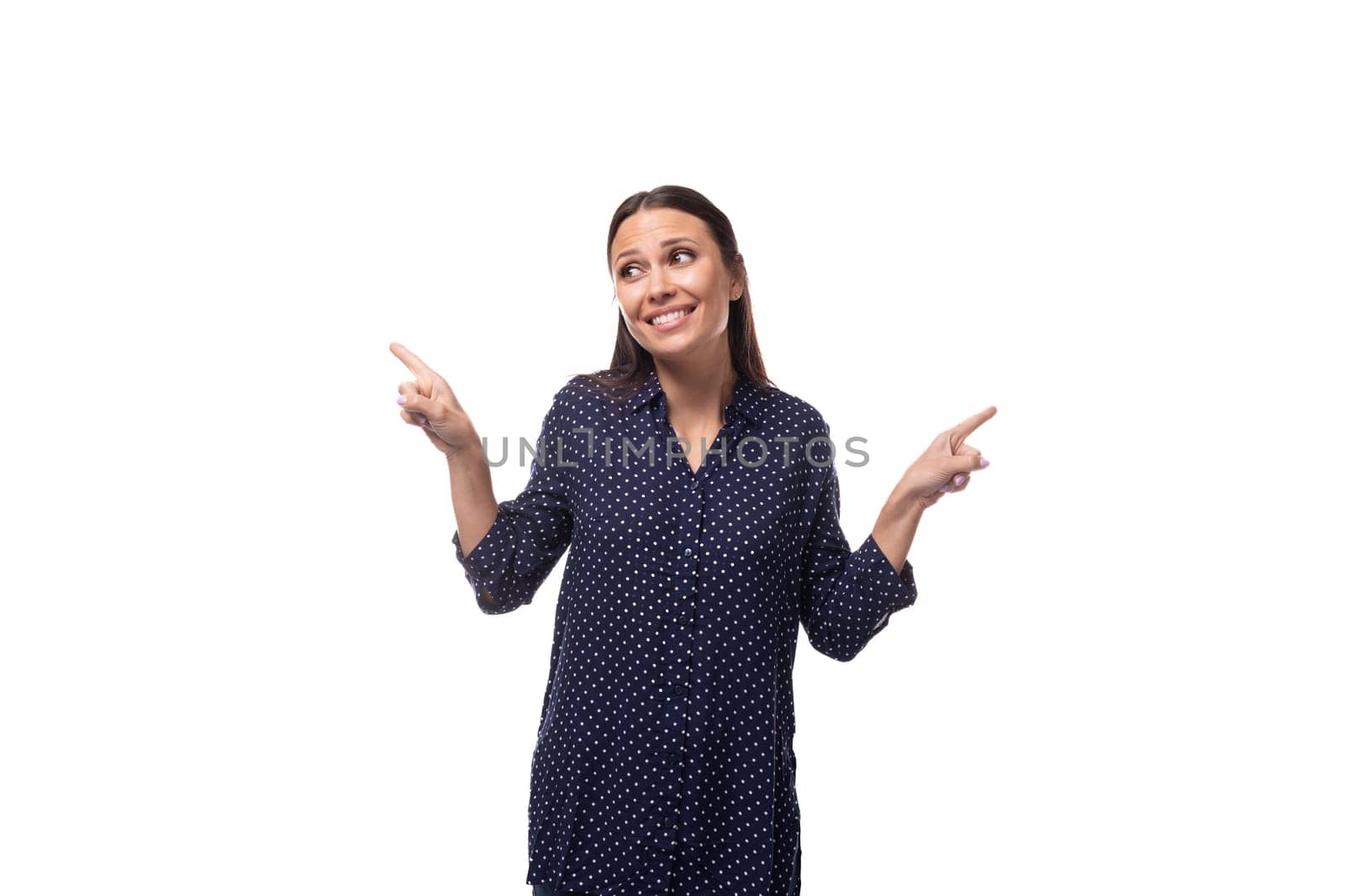 young caucasian fashionable brunette woman dressed in a dark blue blouse on a white background with copy space.