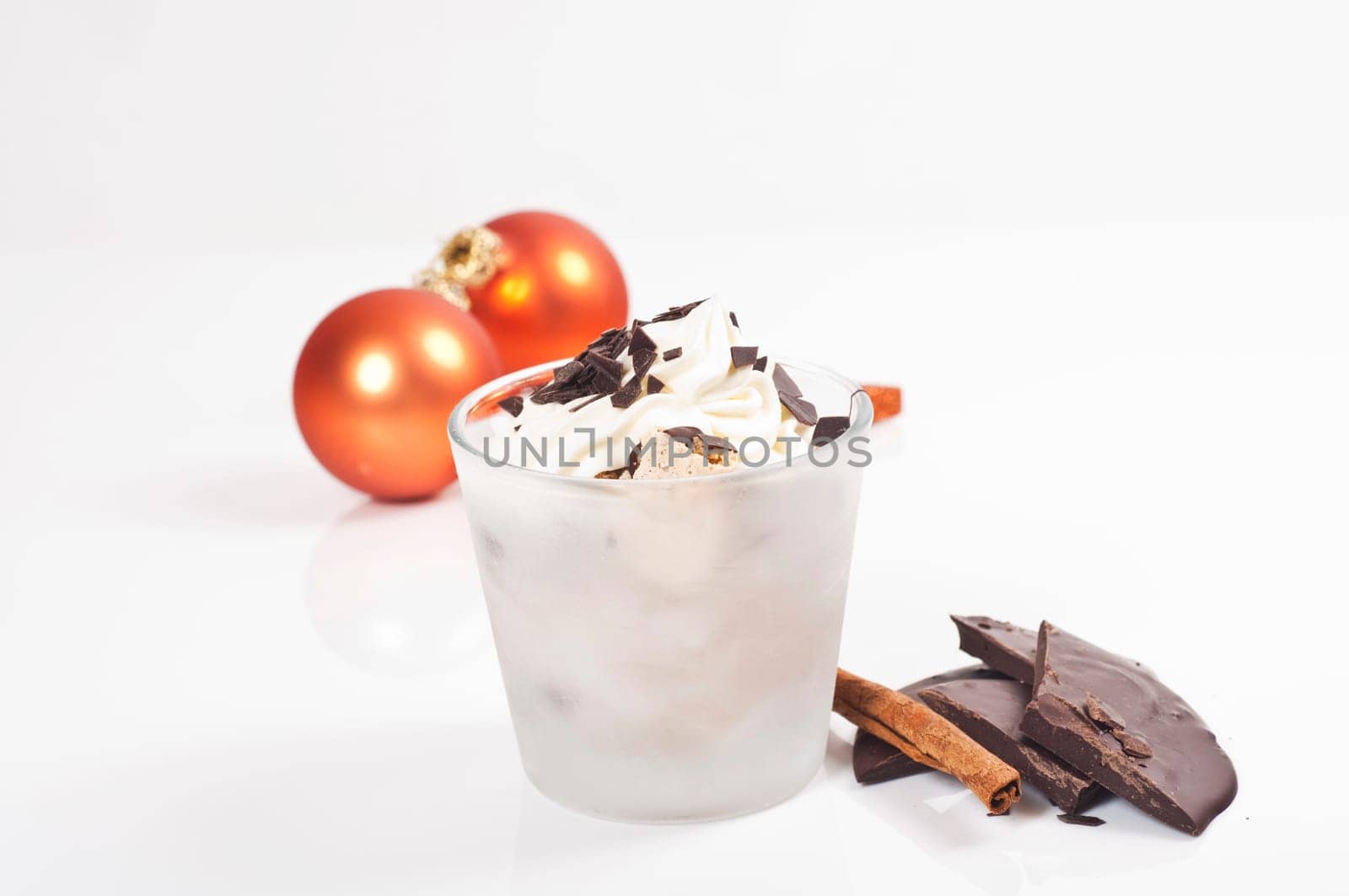 Ice cream dessert in a glass with chocolate and cream topping