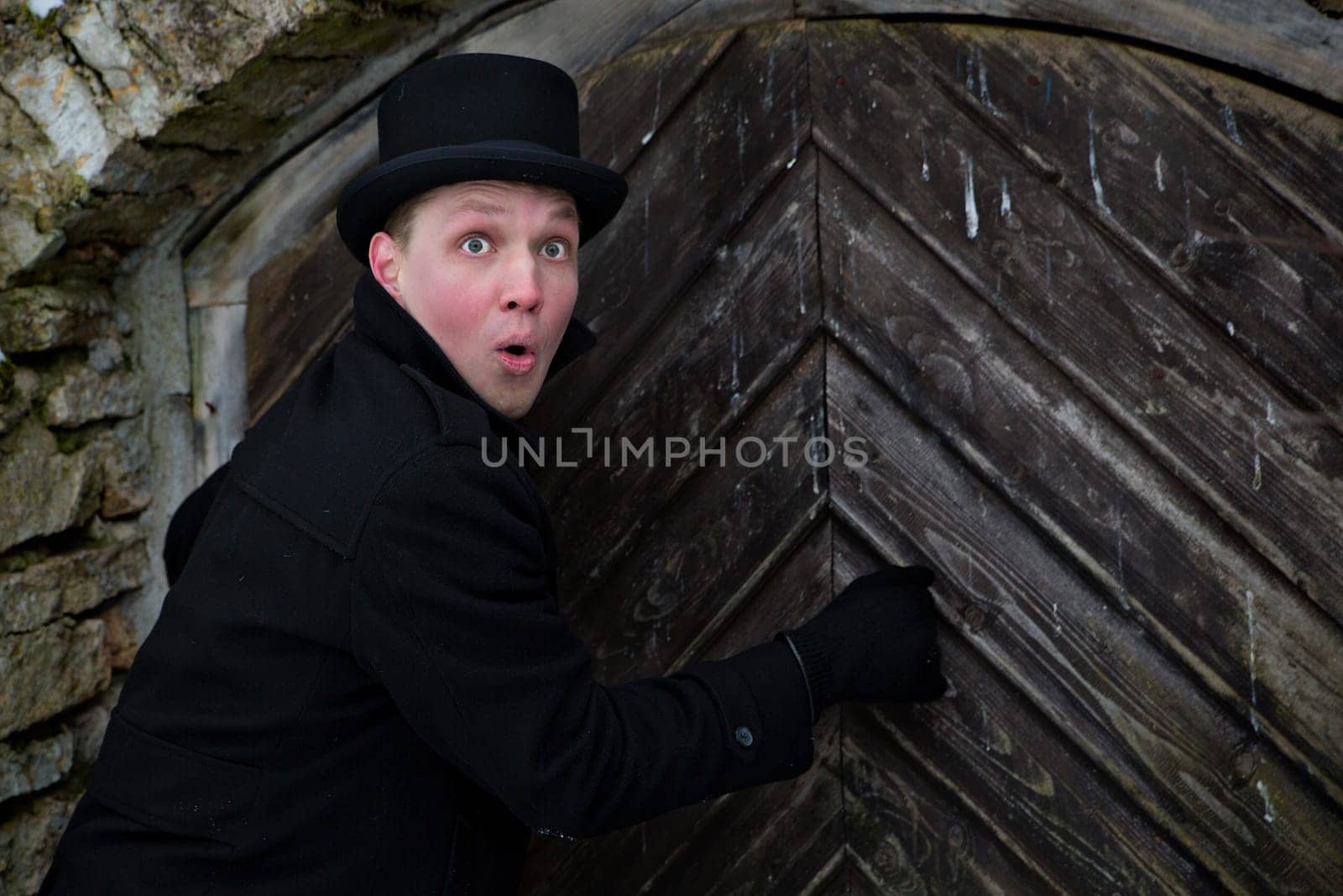 Young man knock on door and wait answer