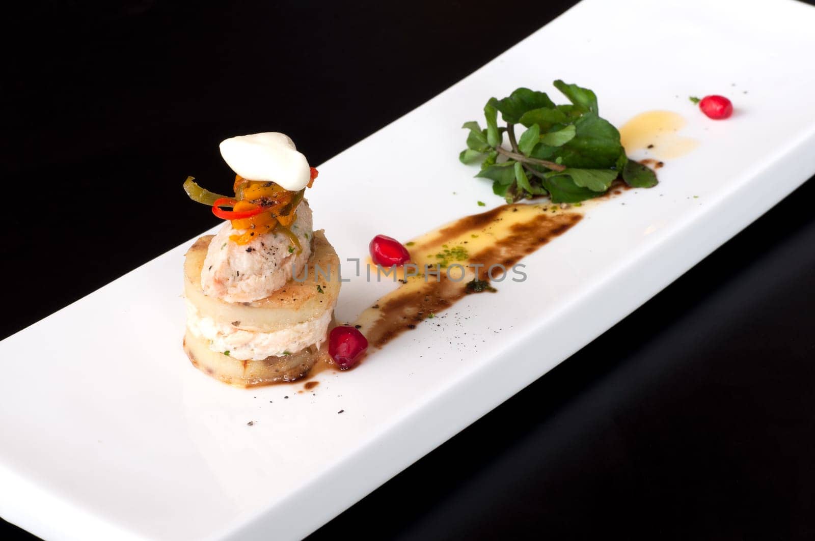 Fish rillettes amuse bouche with pomegranate and fresh basil