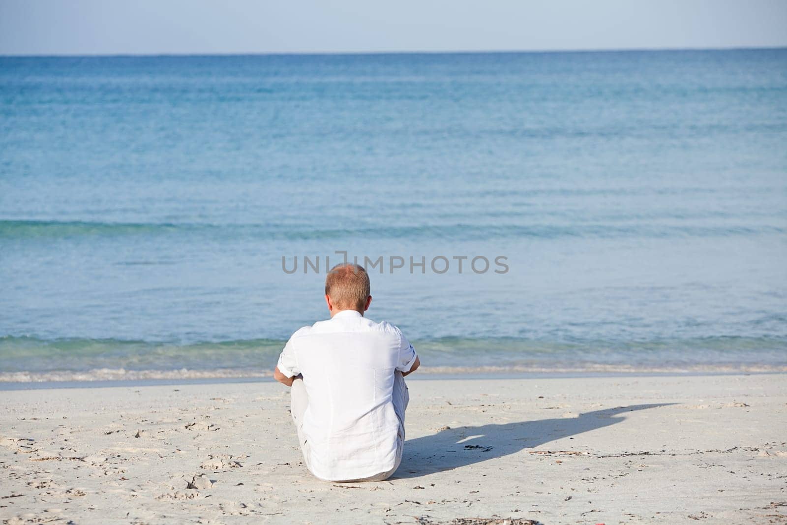Young happy couple in love having fun on the beach in summer