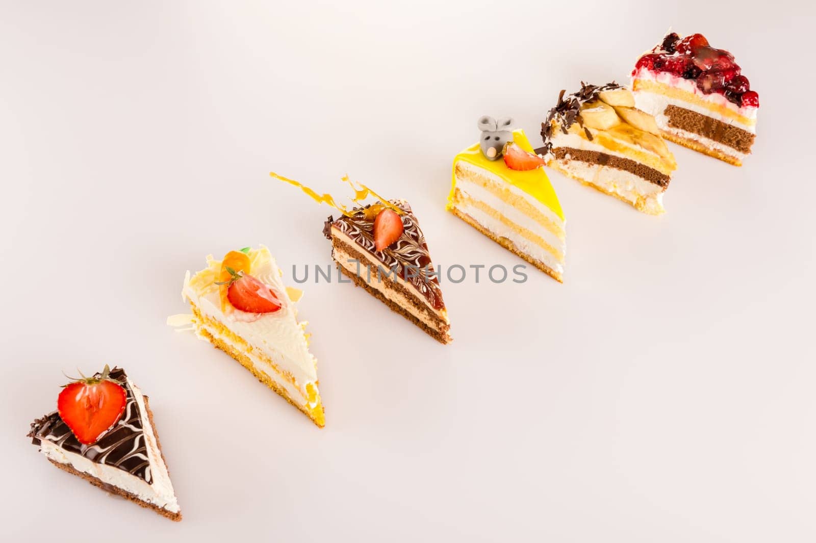 Choice of petite cakes delicious dessert selection display sweet tarts