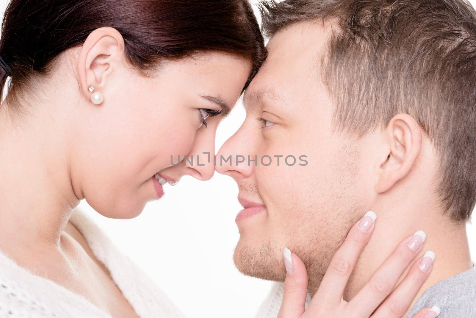 Studio shot of a young couple against a white background