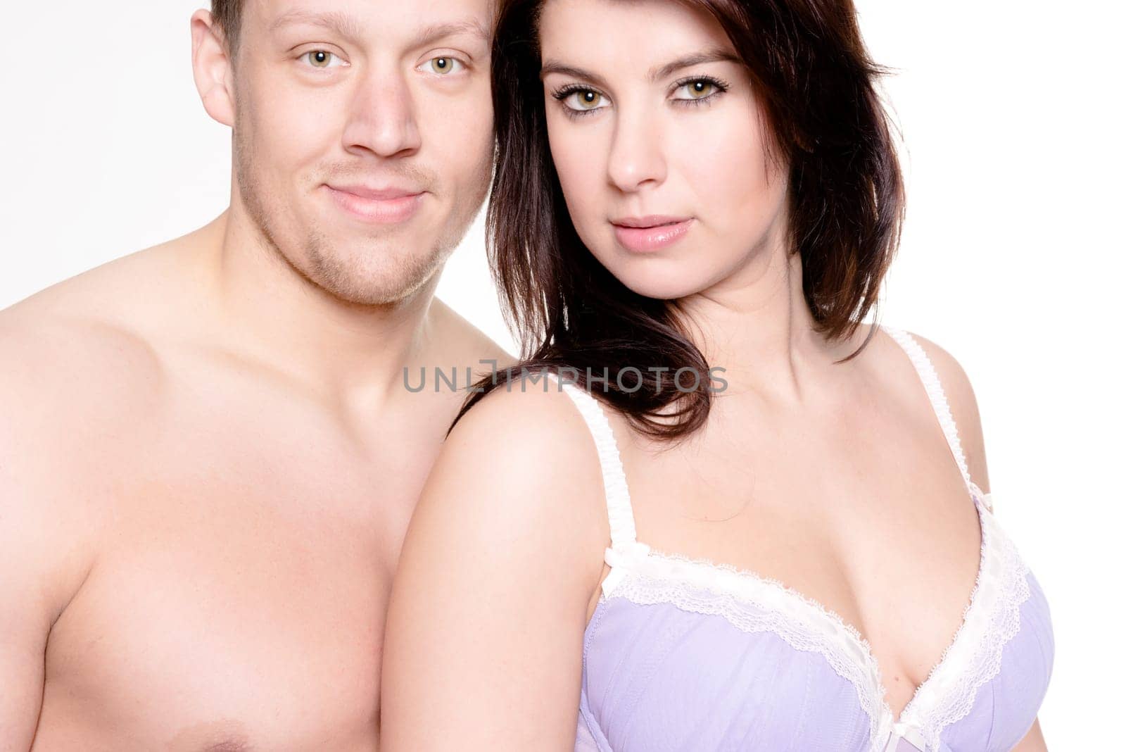 Studio shot of a young couple against a white background