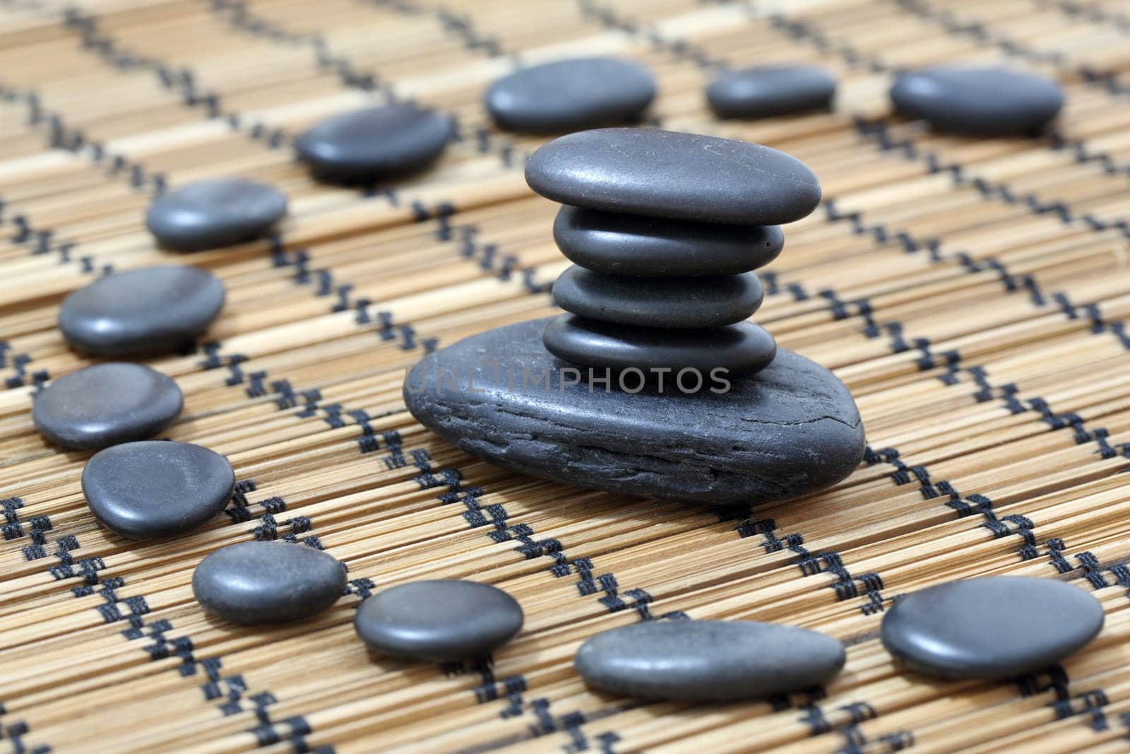 Details of a tranquil scene, made of black pebbles in balance