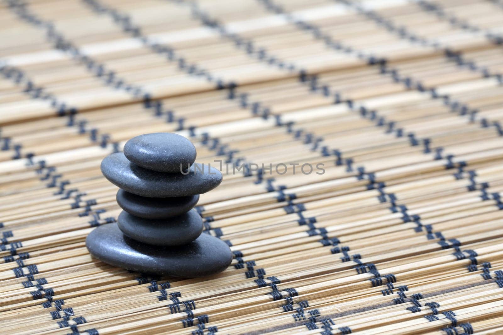 Details of a tranquil scene, made of black pebbles in balance