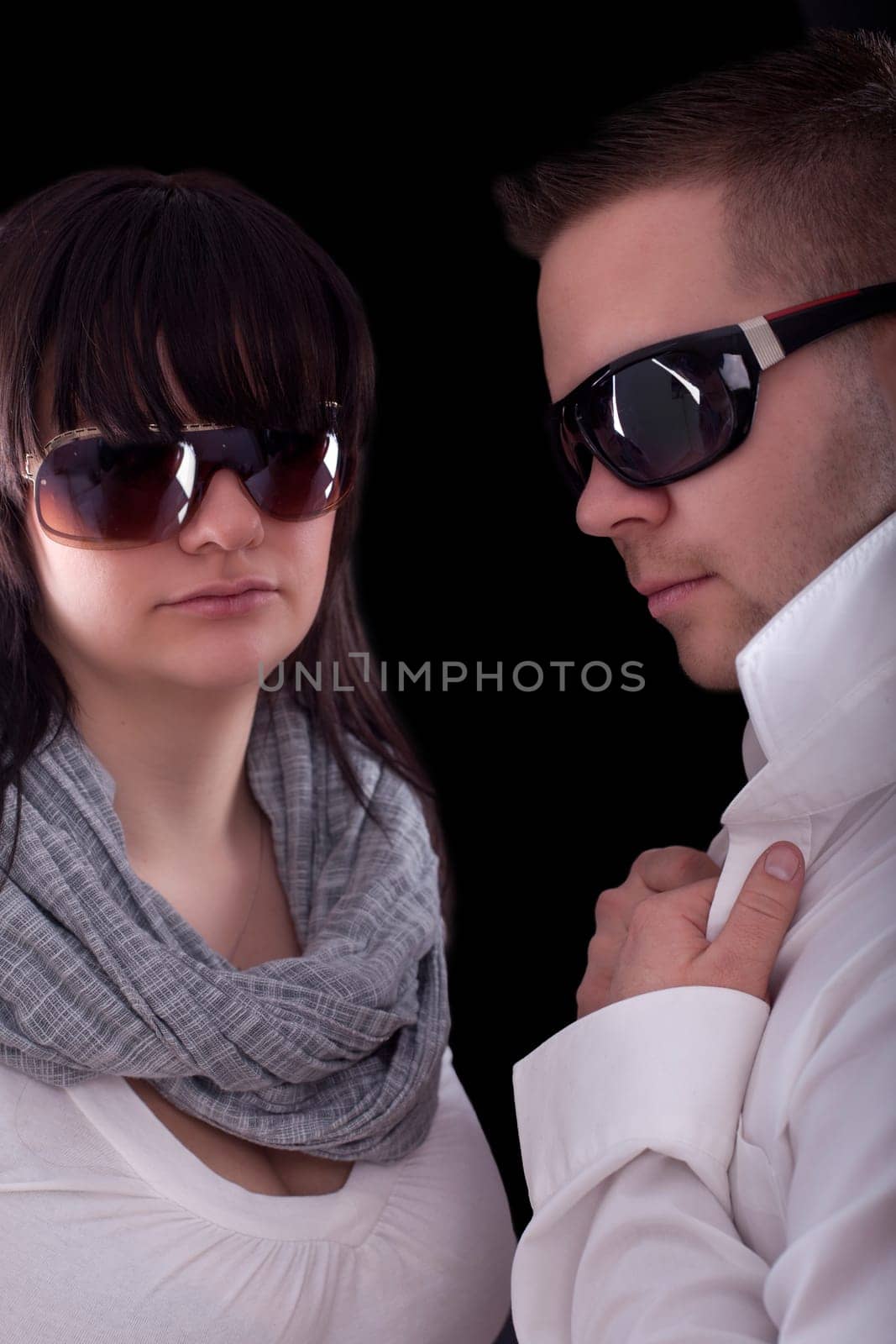 Young modern couple with sunglasses