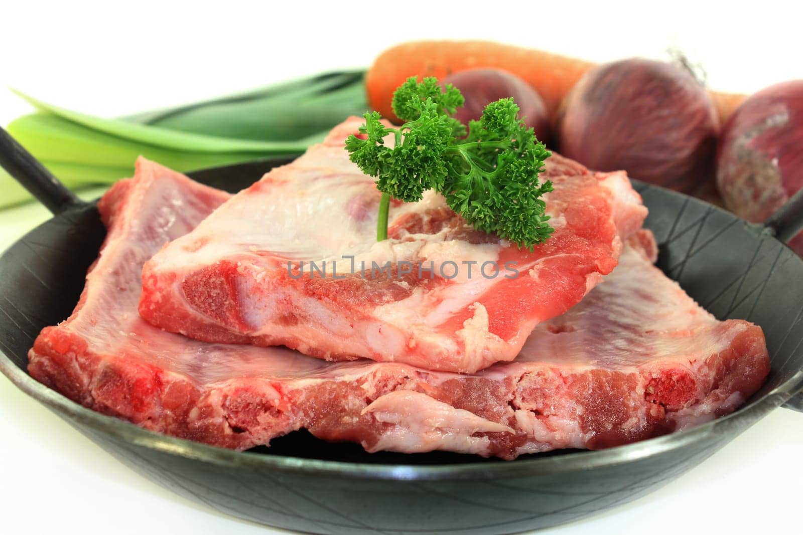 two pieces of peeled ribs against a white background