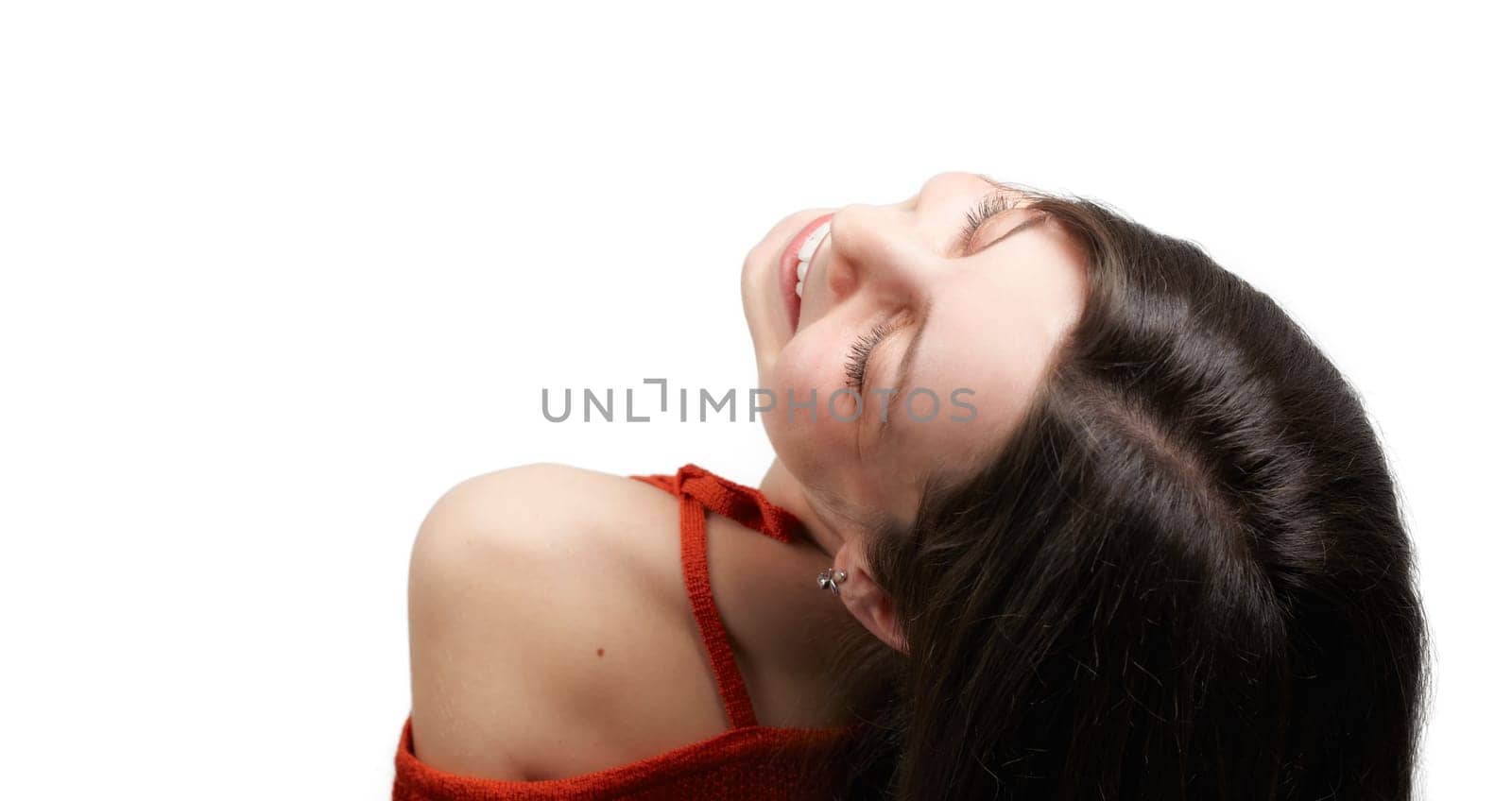 Closeup portrait of young lady with dark hair isolated on white background