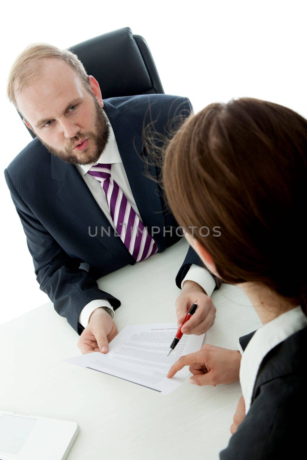 beard business man brunette woman at desk signs contract