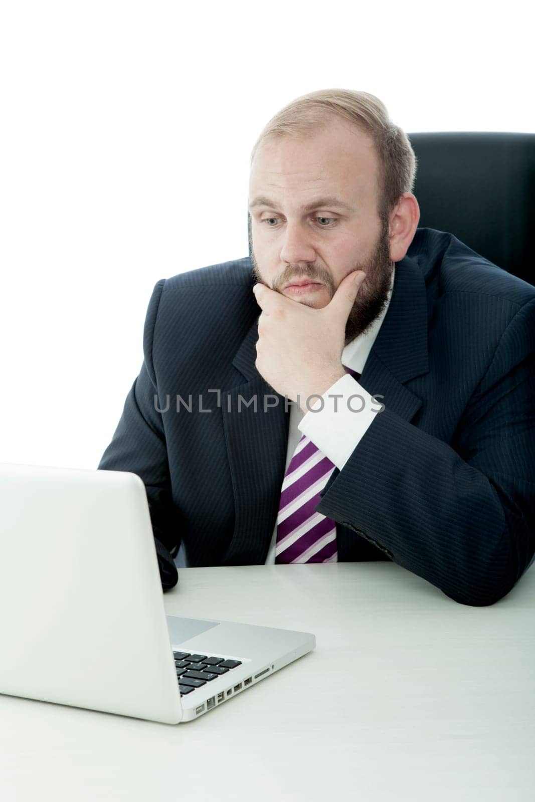 business man on desk think behind laptop