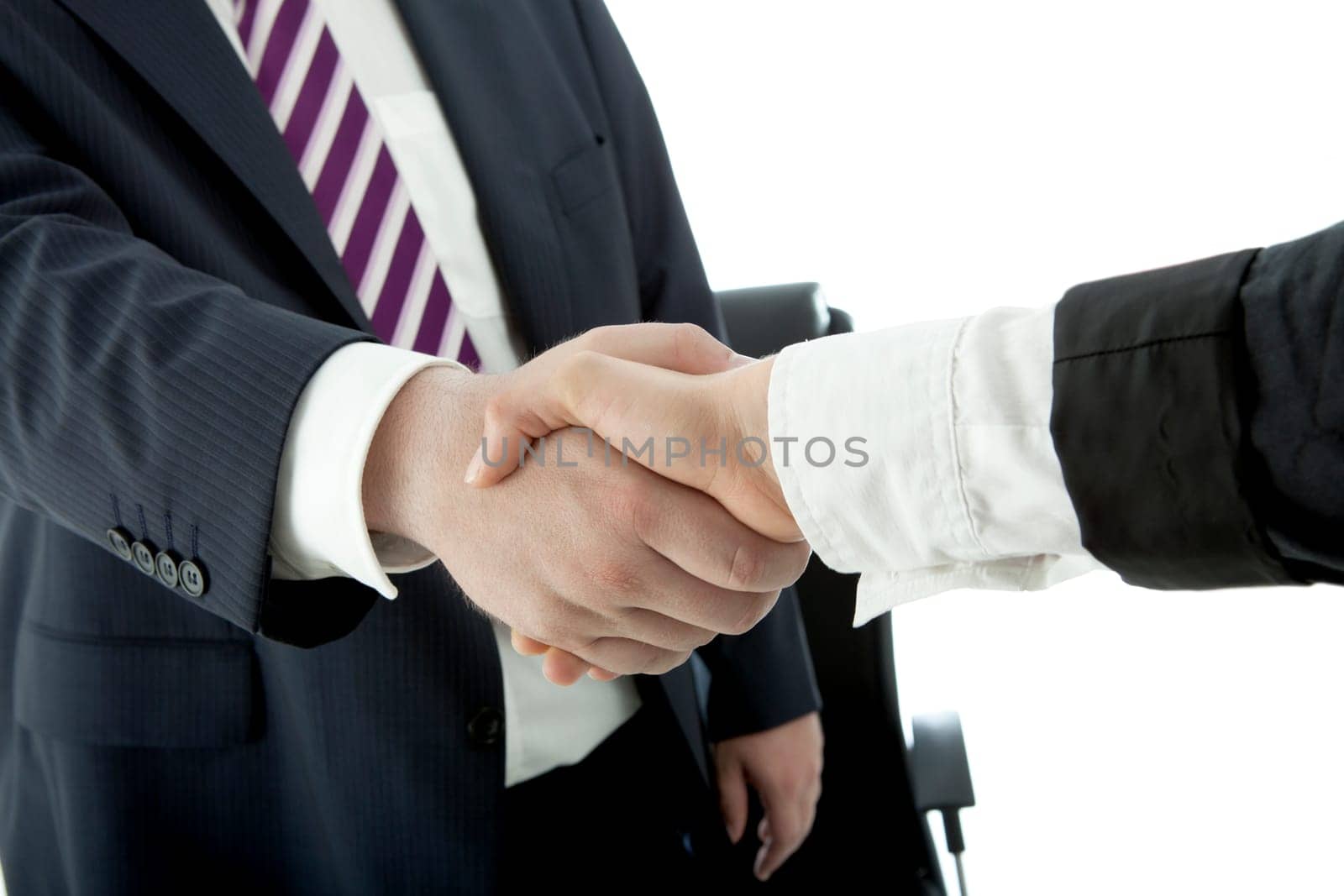 handshake of business man and woman in suit