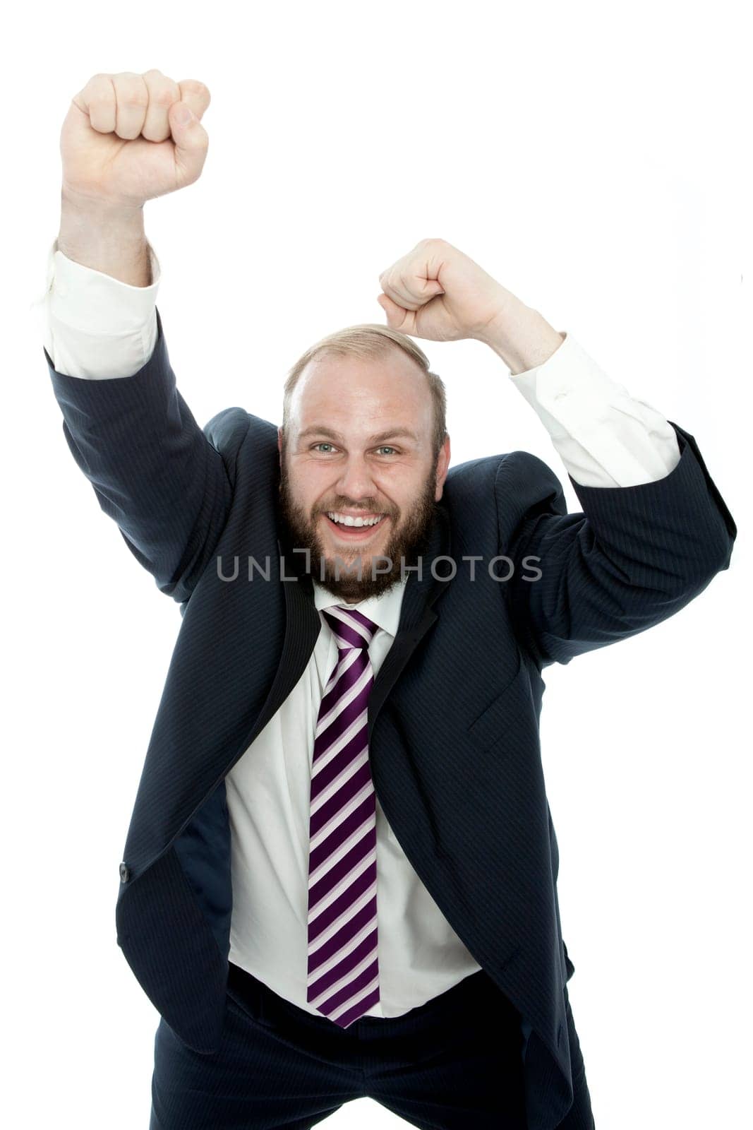 beard business man wins with arms in the air