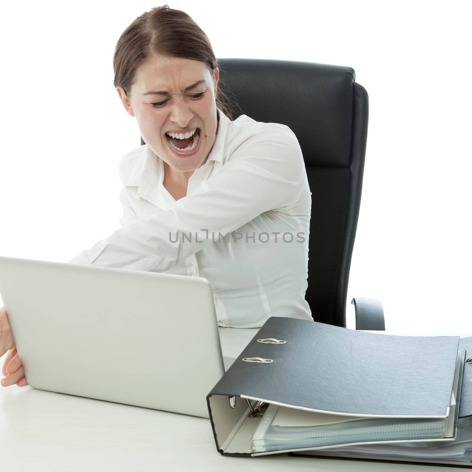 young brunette business woman in rage and throw laptop desk