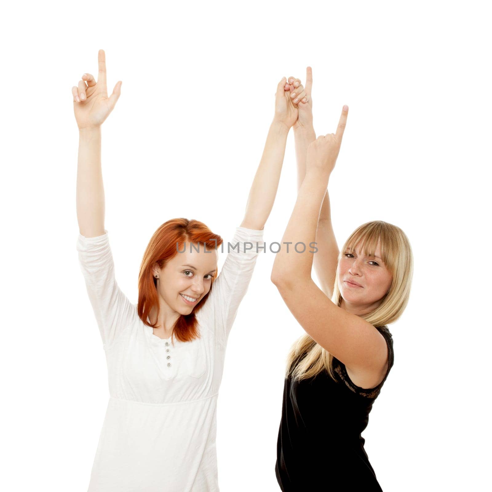 young beautiful red and blond haired girls in front of white background
