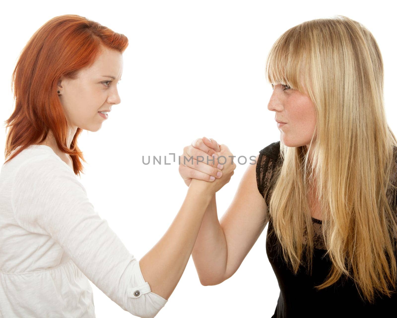 young beautiful red and blond haired girls in front of white background