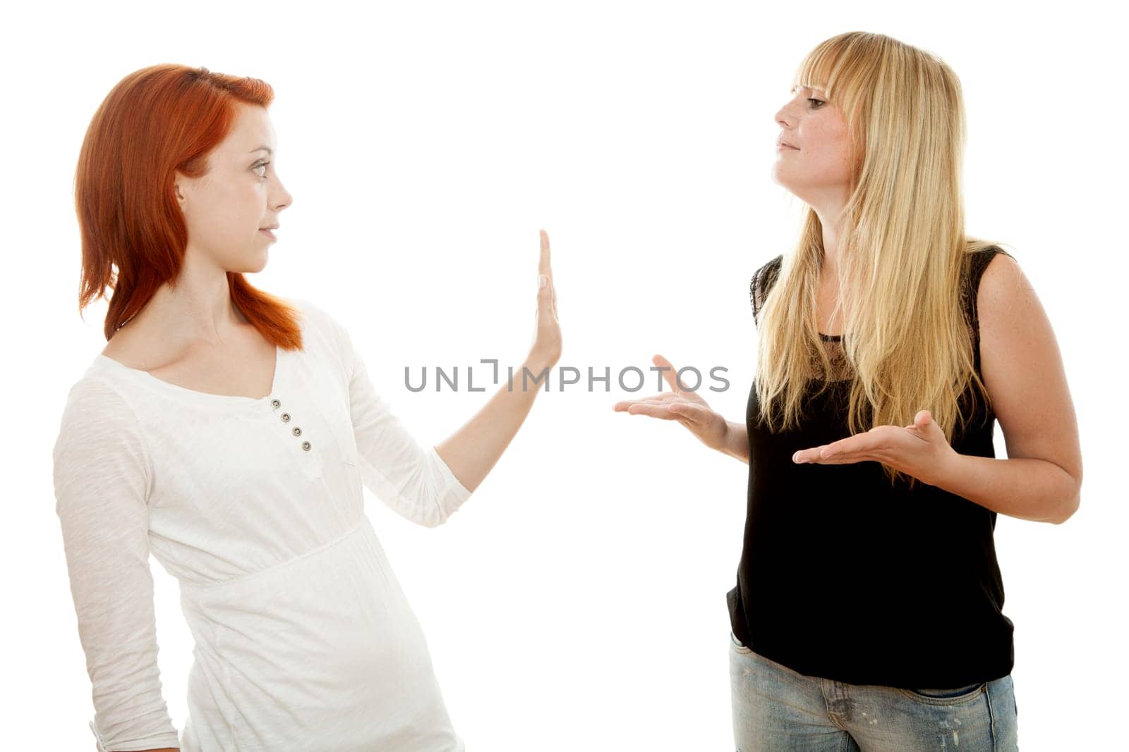 young beautiful red and blond haired girls in front of white background