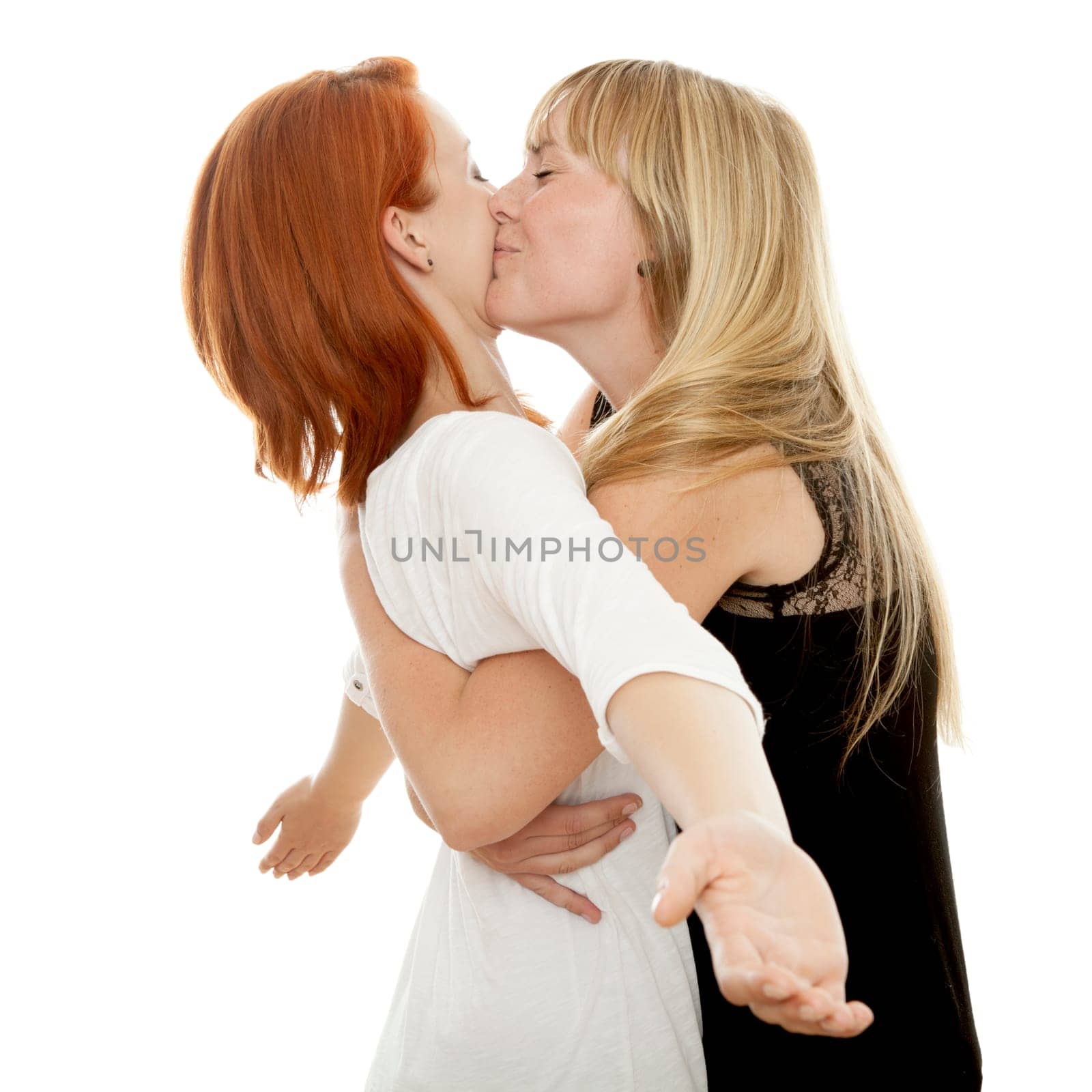 young beautiful red and blond haired girls in front of white background
