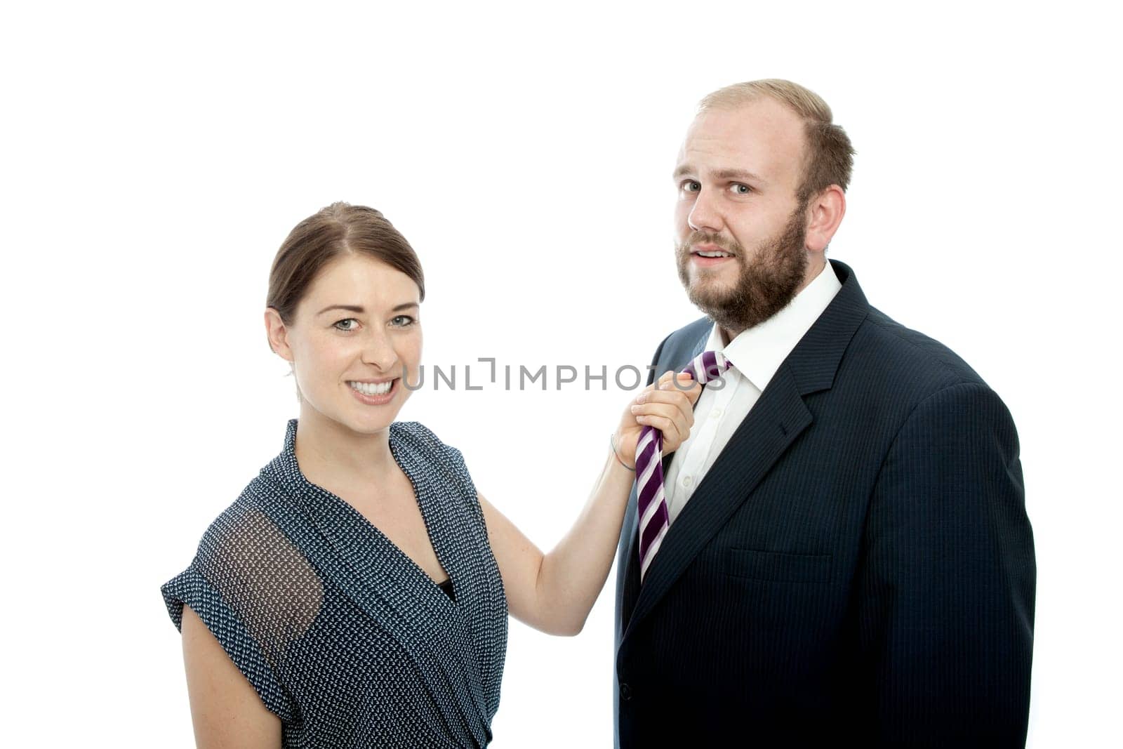 young brunette woman and beard business man pulls tie