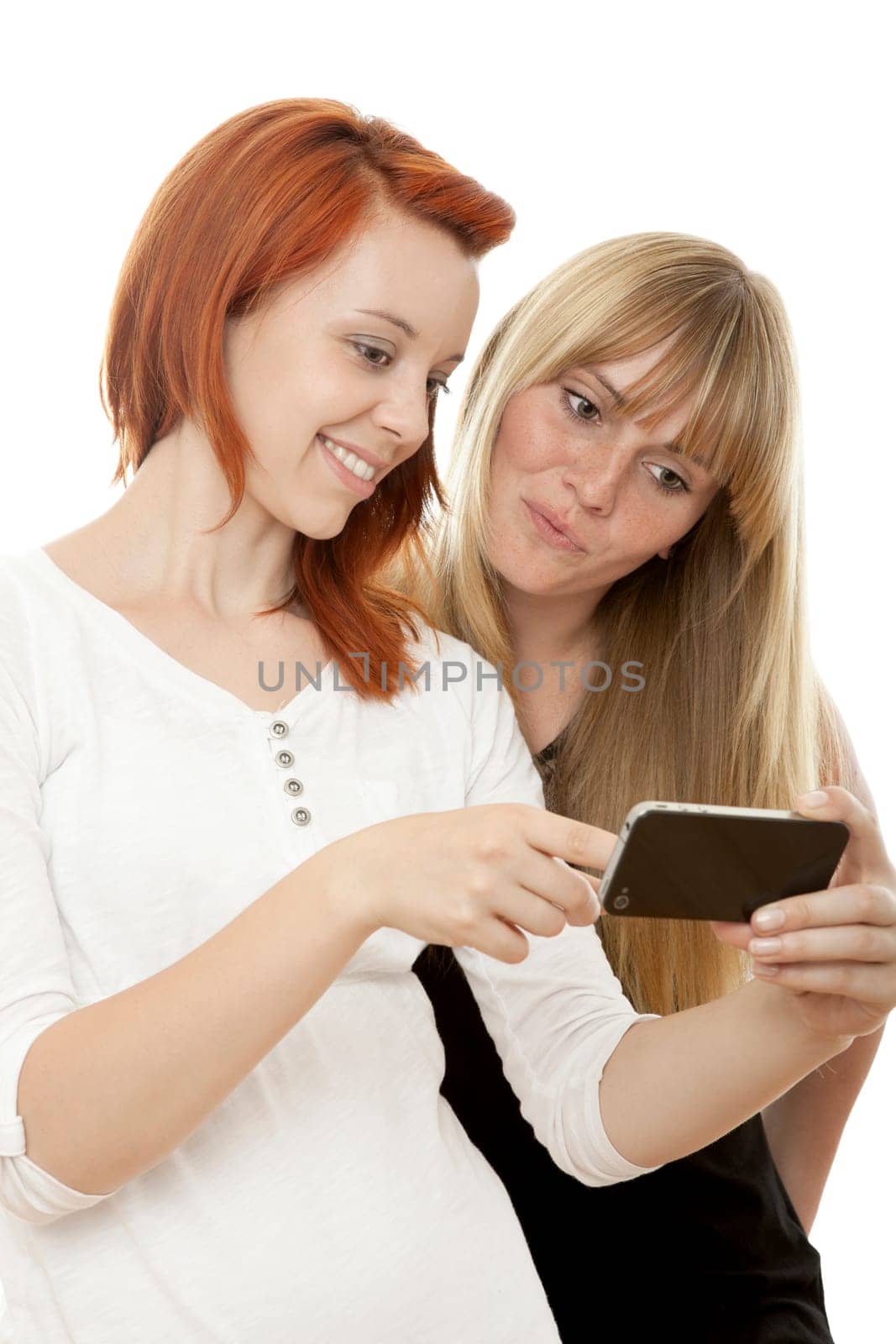 young beautiful red and blond haired girls in front of white background